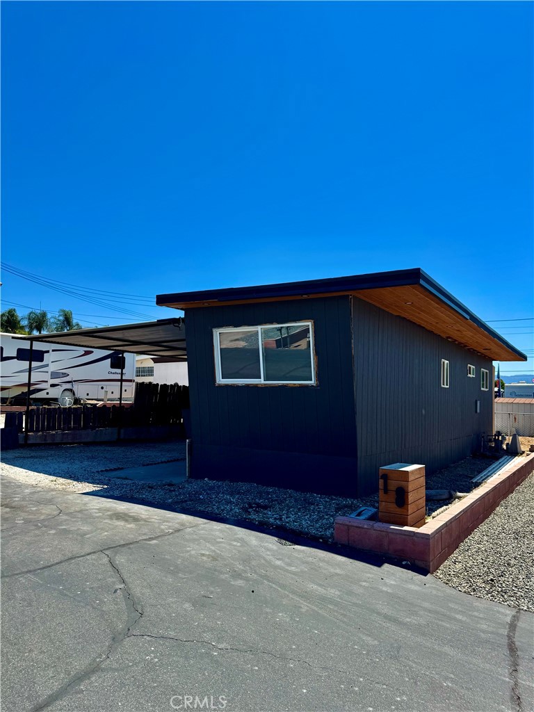 a backyard of a house with wooden fence