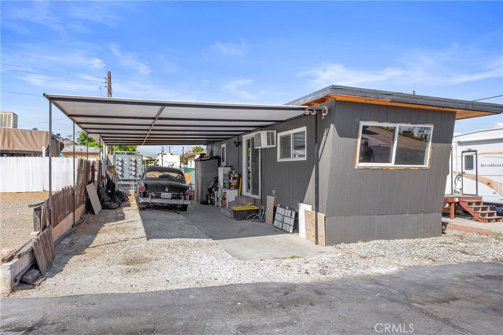 12149 Indiana Avenue, Unit 18 Riverside, CA 92503 - Photo 11 of 12 a view of a porch with furniture and floor to ceiling window