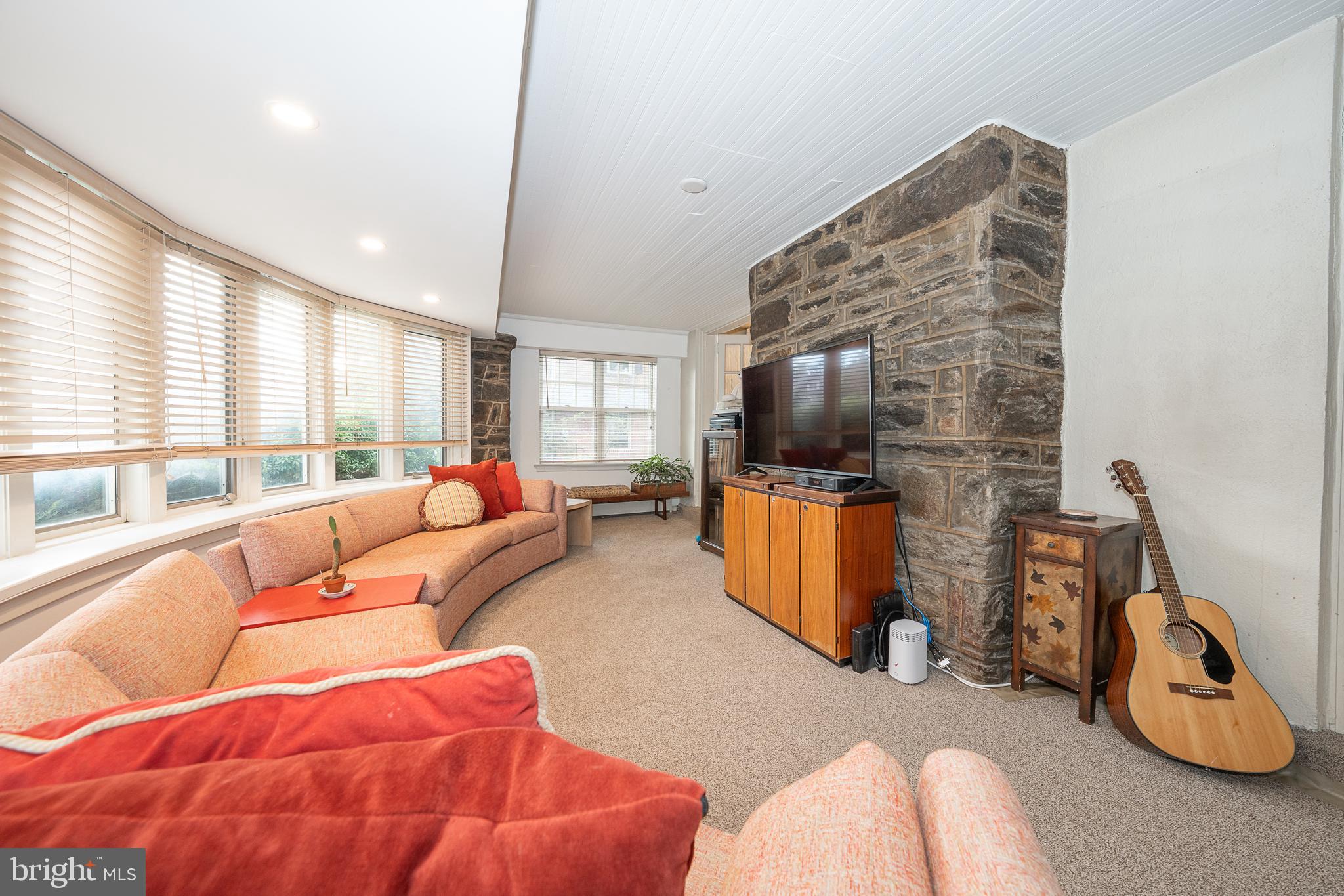 9 Shirley Road Narberth, PA 19072 - Photo 19 of 87 a living room with furniture a flat screen tv and a large window