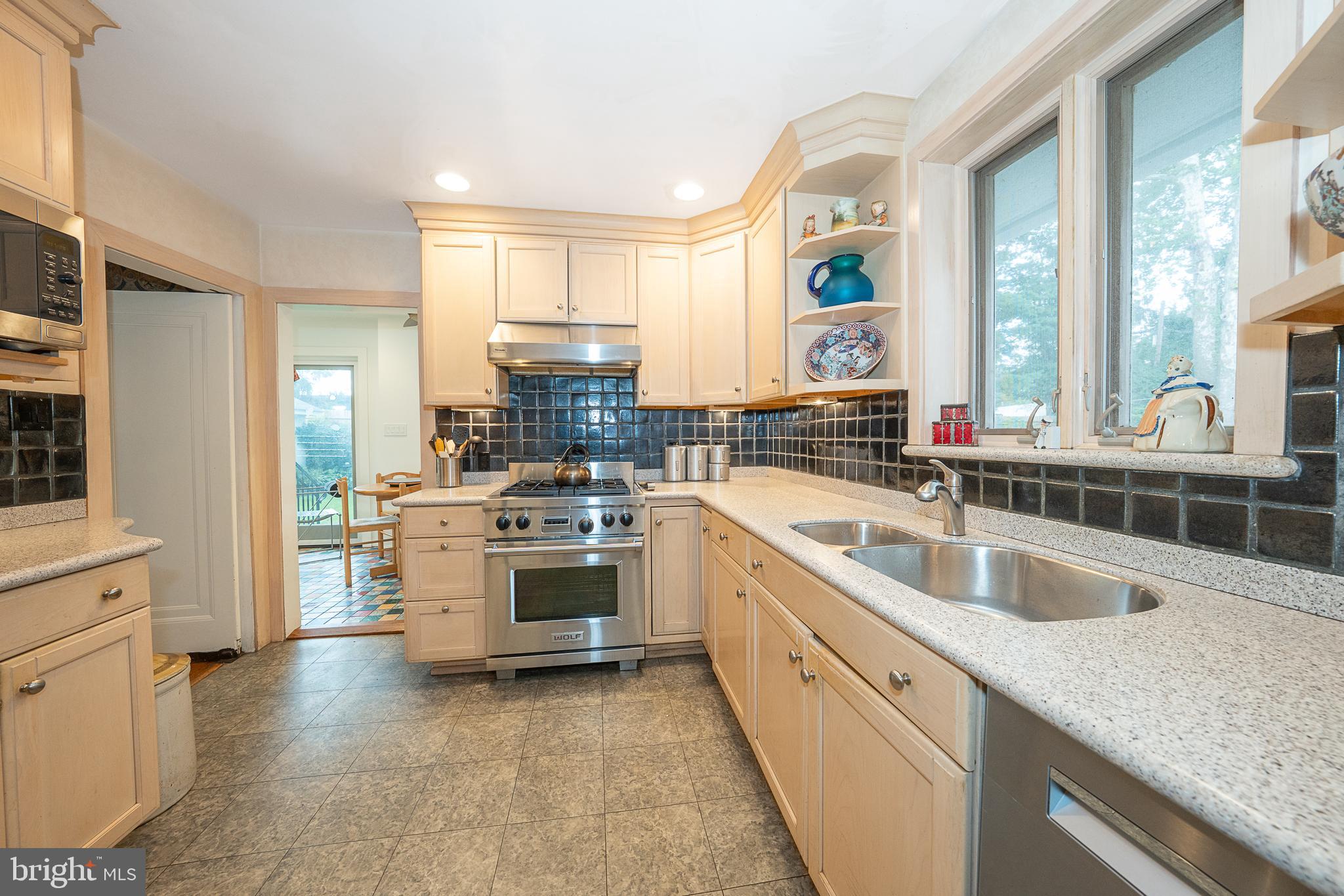 9 Shirley Road Narberth, PA 19072 - Photo 33 of 87 a kitchen with a sink stove and cabinets