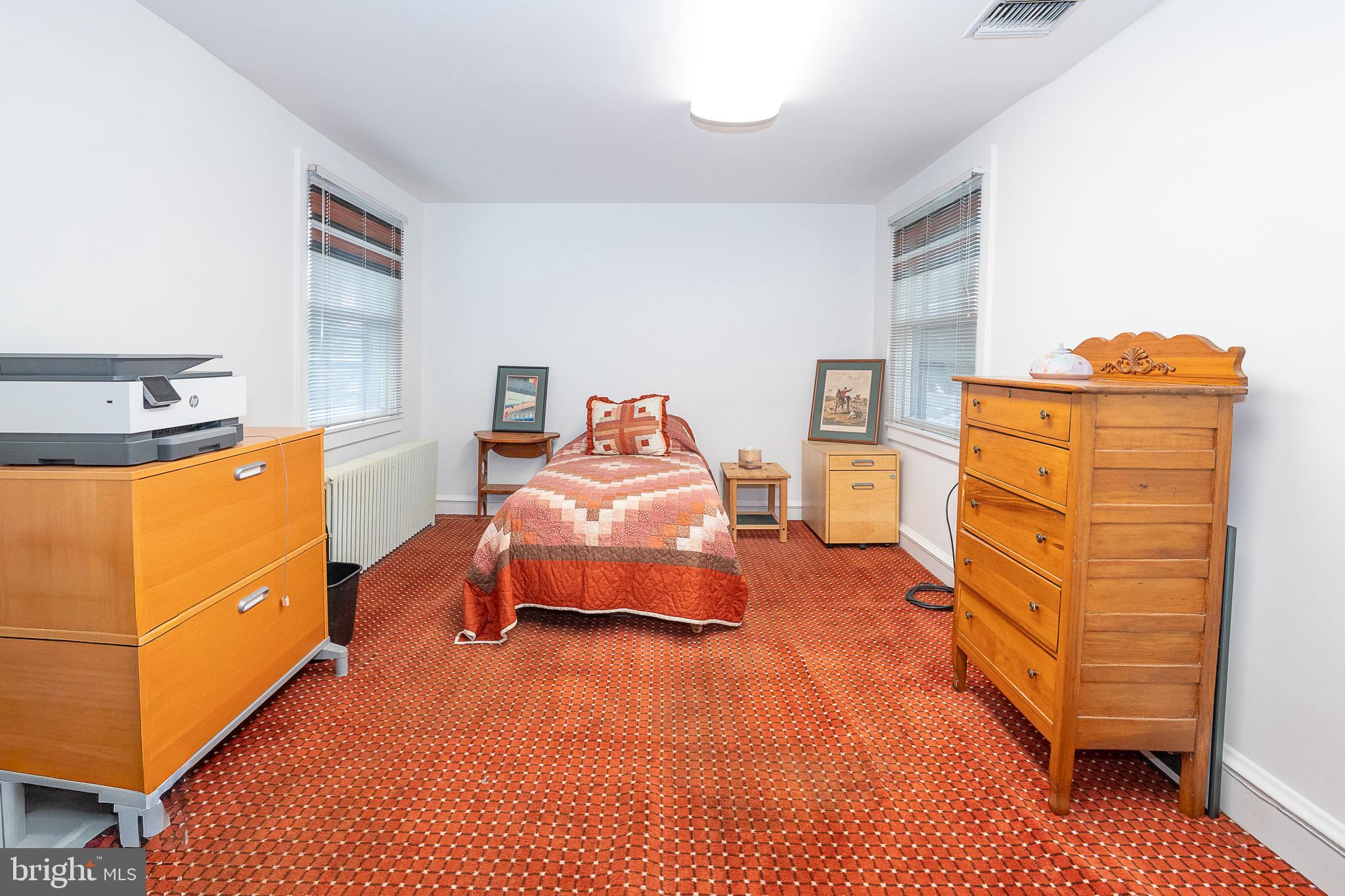 9 Shirley Road Narberth, PA 19072 - Photo 39 of 87 a bedroom with a bed and wooden floor