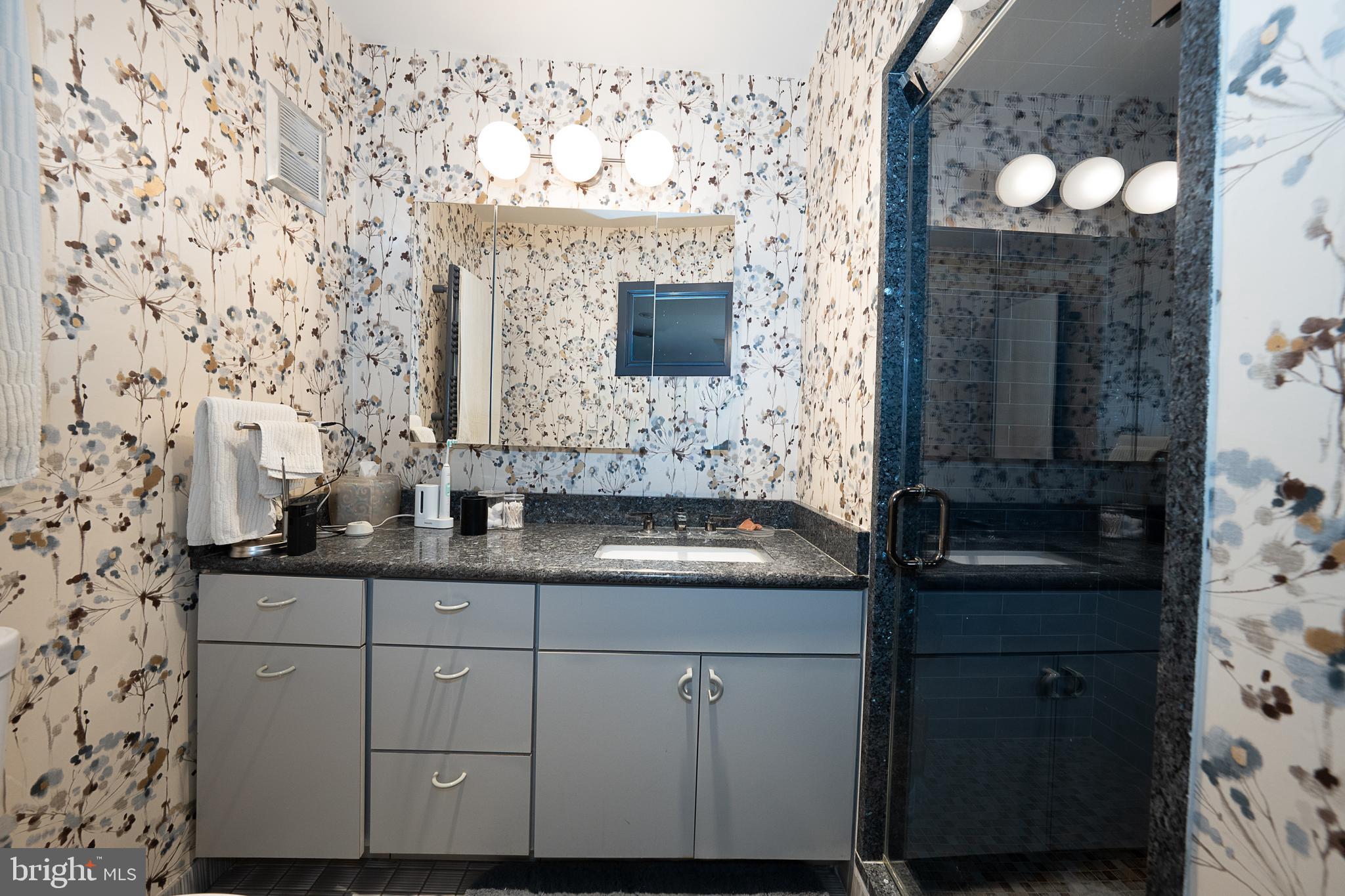9 Shirley Road Narberth, PA 19072 - Photo 52 of 87 a bathroom with a sink and a mirror