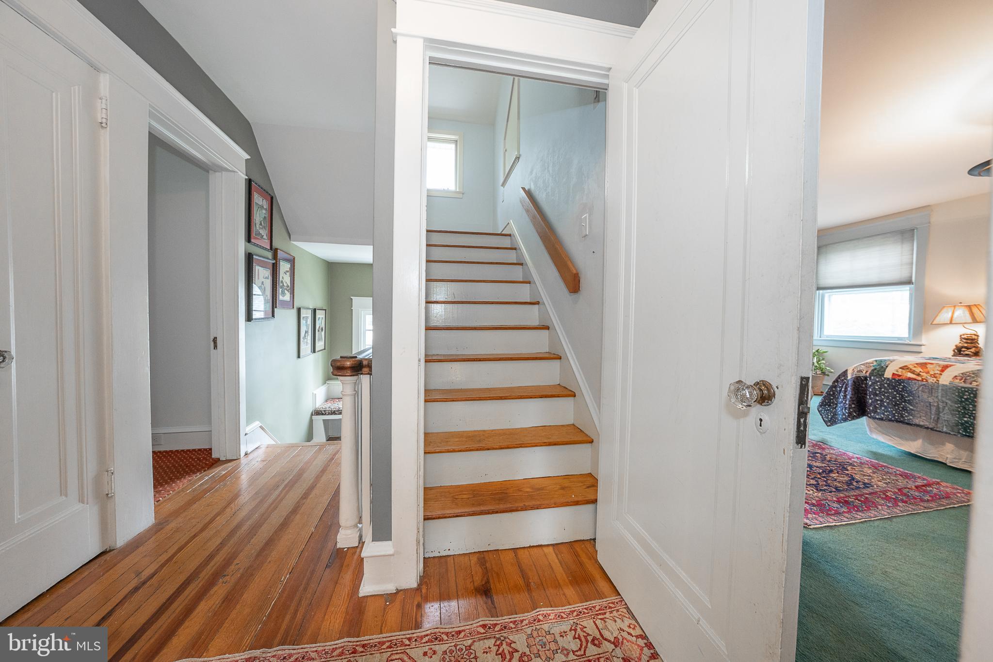 9 Shirley Road Narberth, PA 19072 - Photo 55 of 87 a view of a hallway with wooden floor and stairs