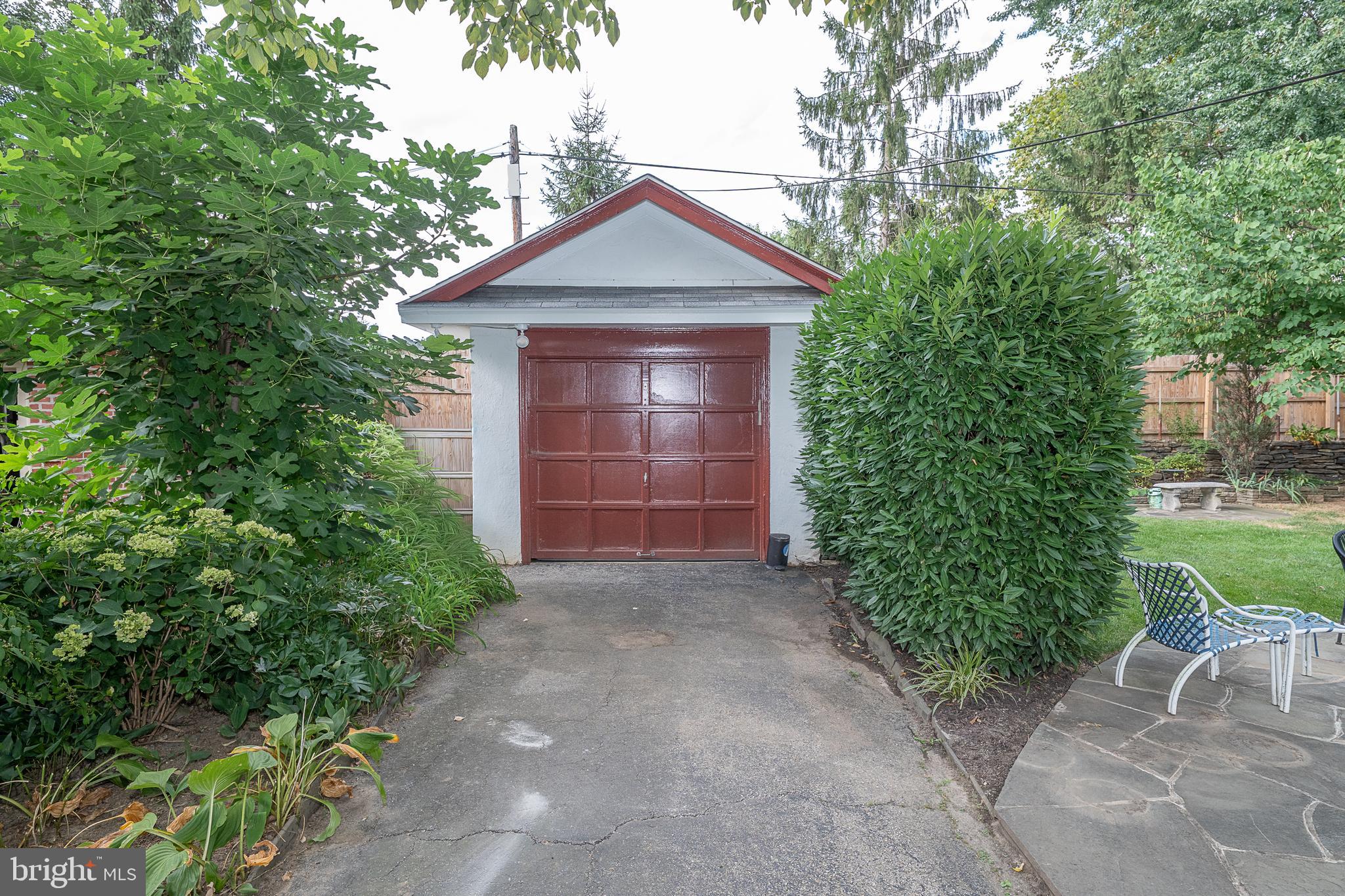 9 Shirley Road Narberth, PA 19072 - Photo 73 of 87 a front view of a house with a yard and garage