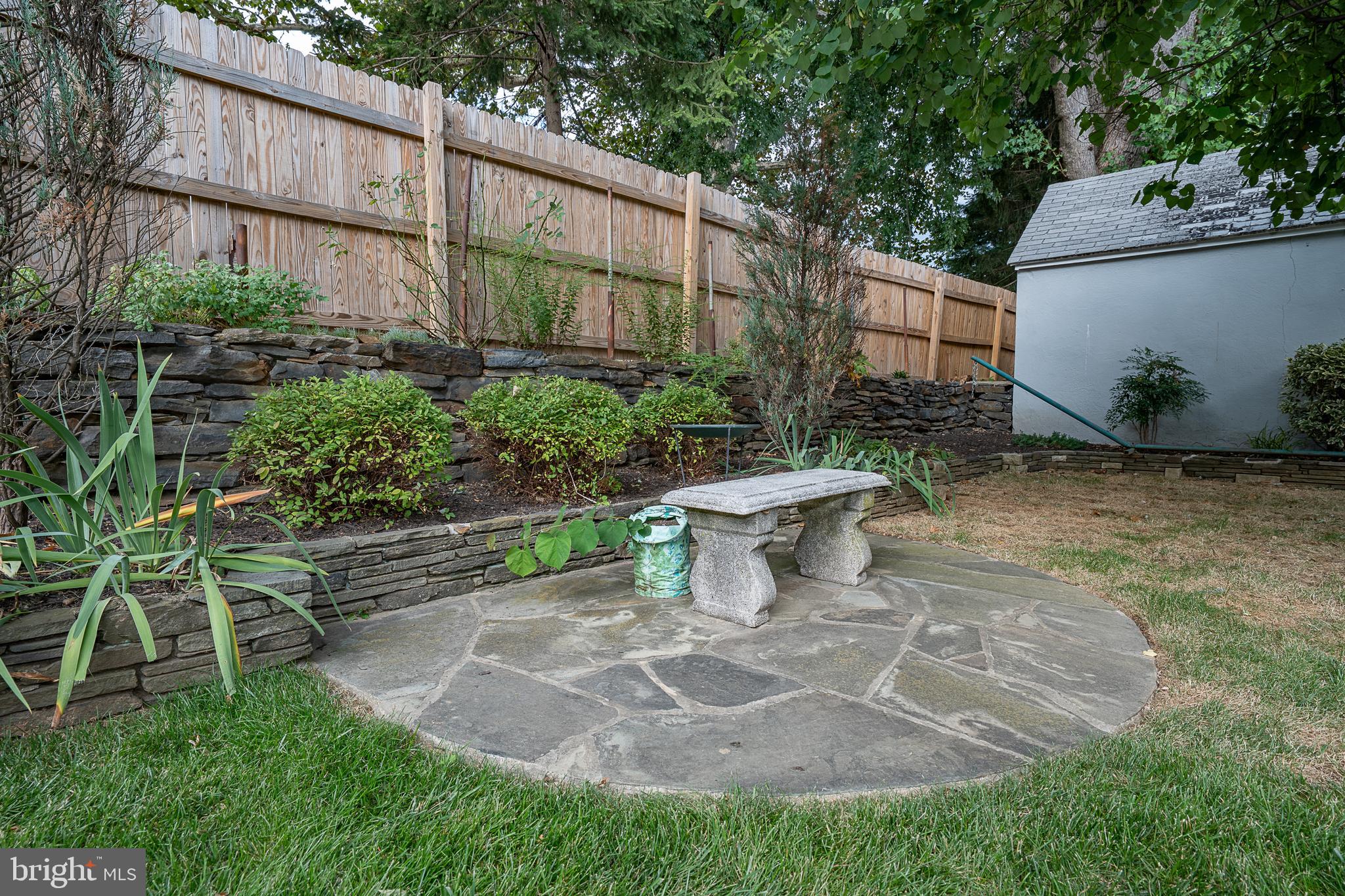 9 Shirley Road Narberth, PA 19072 - Photo 80 of 87 a view of a backyard with plants and outdoor seating