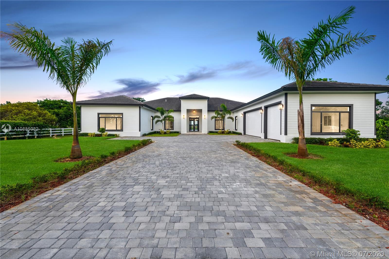 6122 Southwest 173rd Way Southwest Ranches, FL 33331 - Photo 1 of 29 a front view of house with yard and green space