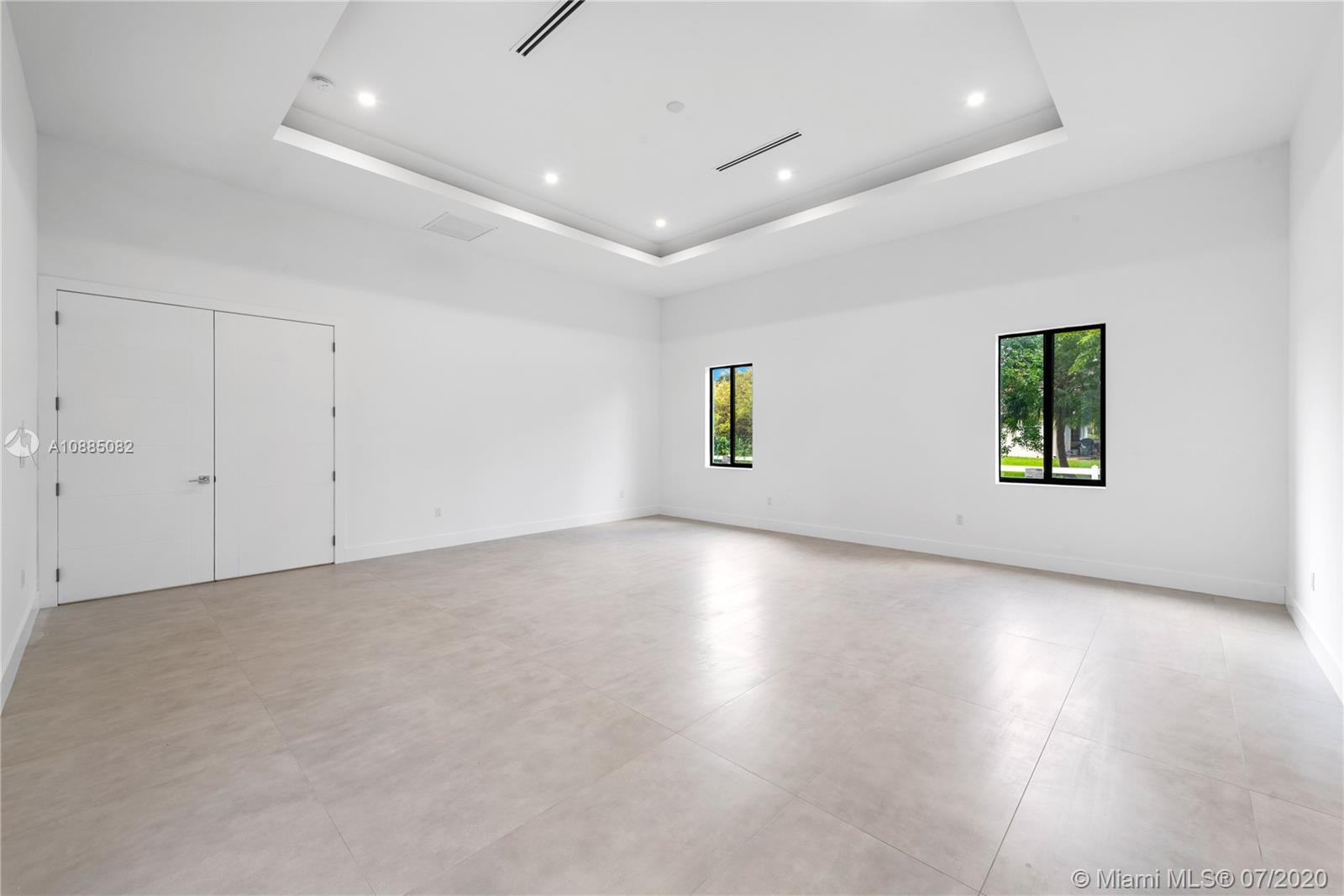 6122 Southwest 173rd Way Southwest Ranches, FL 33331 - Photo 14 of 29 an empty room with wooden floor and windows