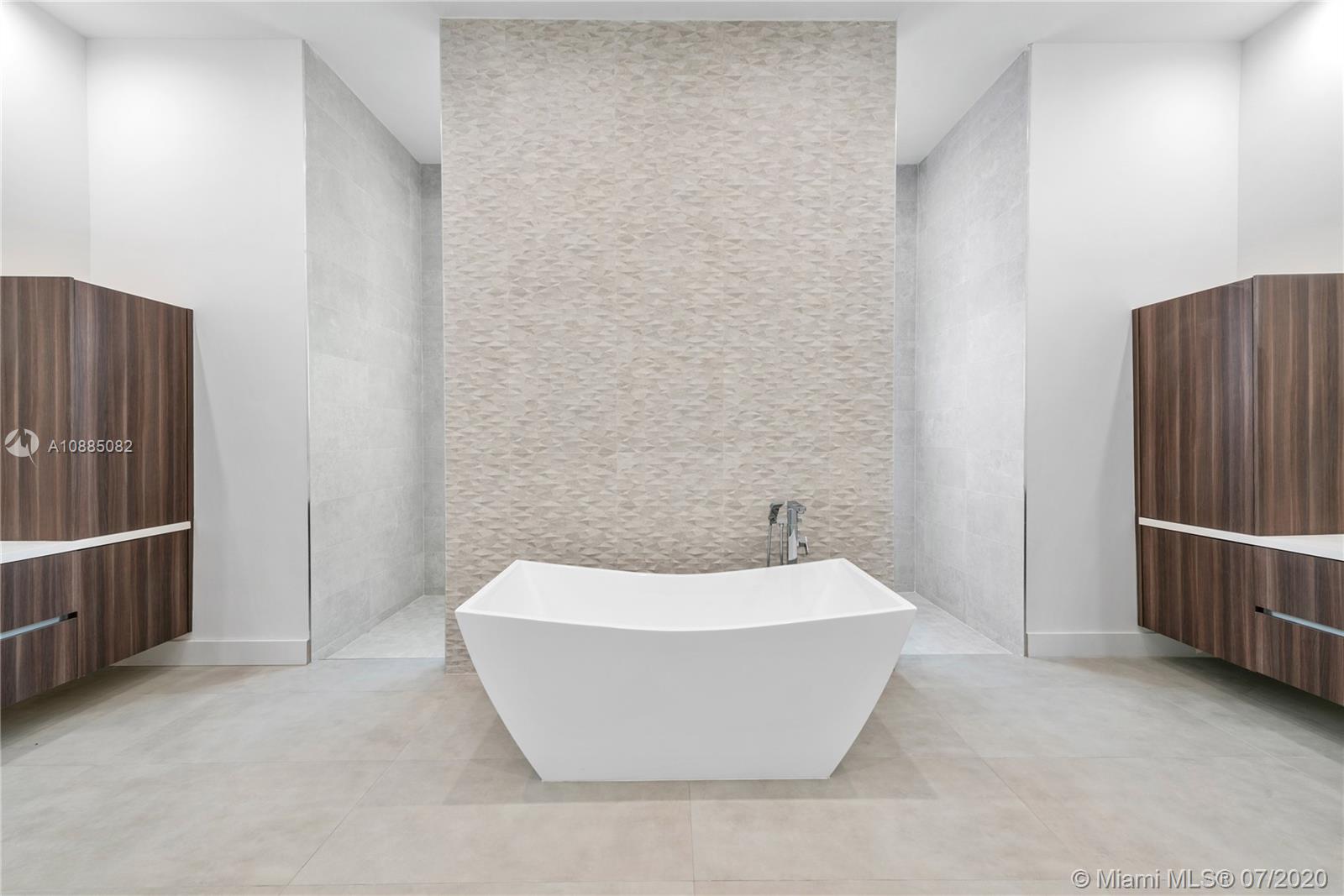 6122 Southwest 173rd Way Southwest Ranches, FL 33331 - Photo 15 of 29 a white bath tub sitting in a bathroom