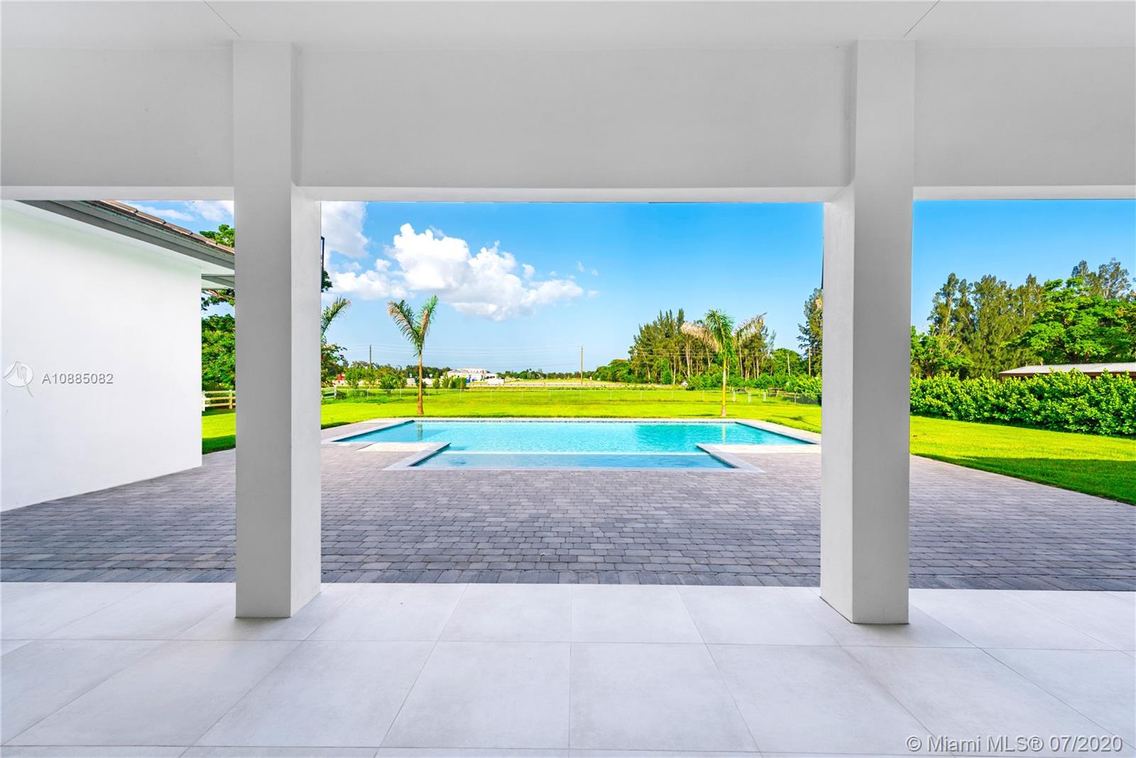 6122 Southwest 173rd Way Southwest Ranches, FL 33331 - Photo 25 of 29 a view of a swimming pool with a yard