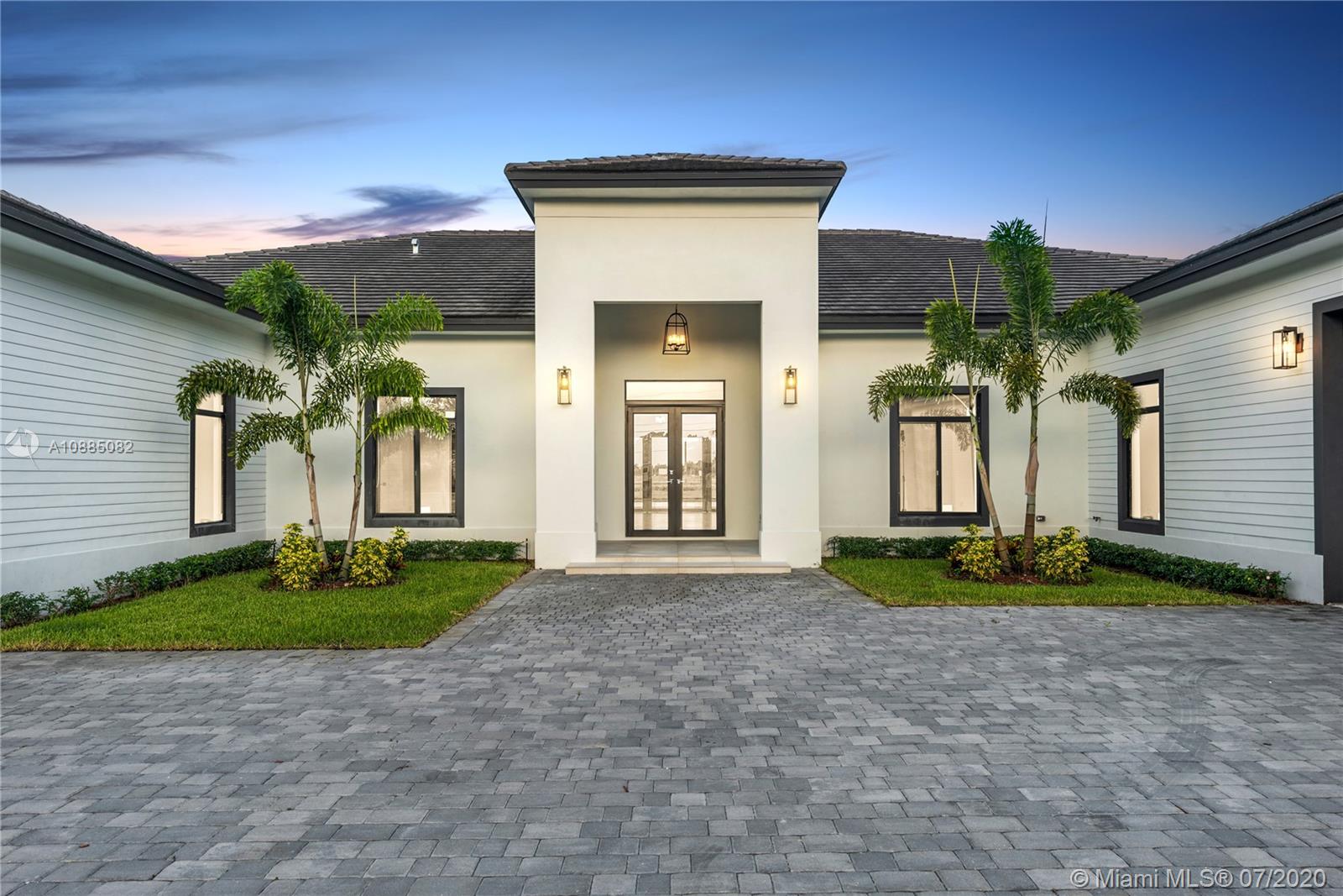 6122 Southwest 173rd Way Southwest Ranches, FL 33331 - Photo 5 of 29 a front view of a house with garden