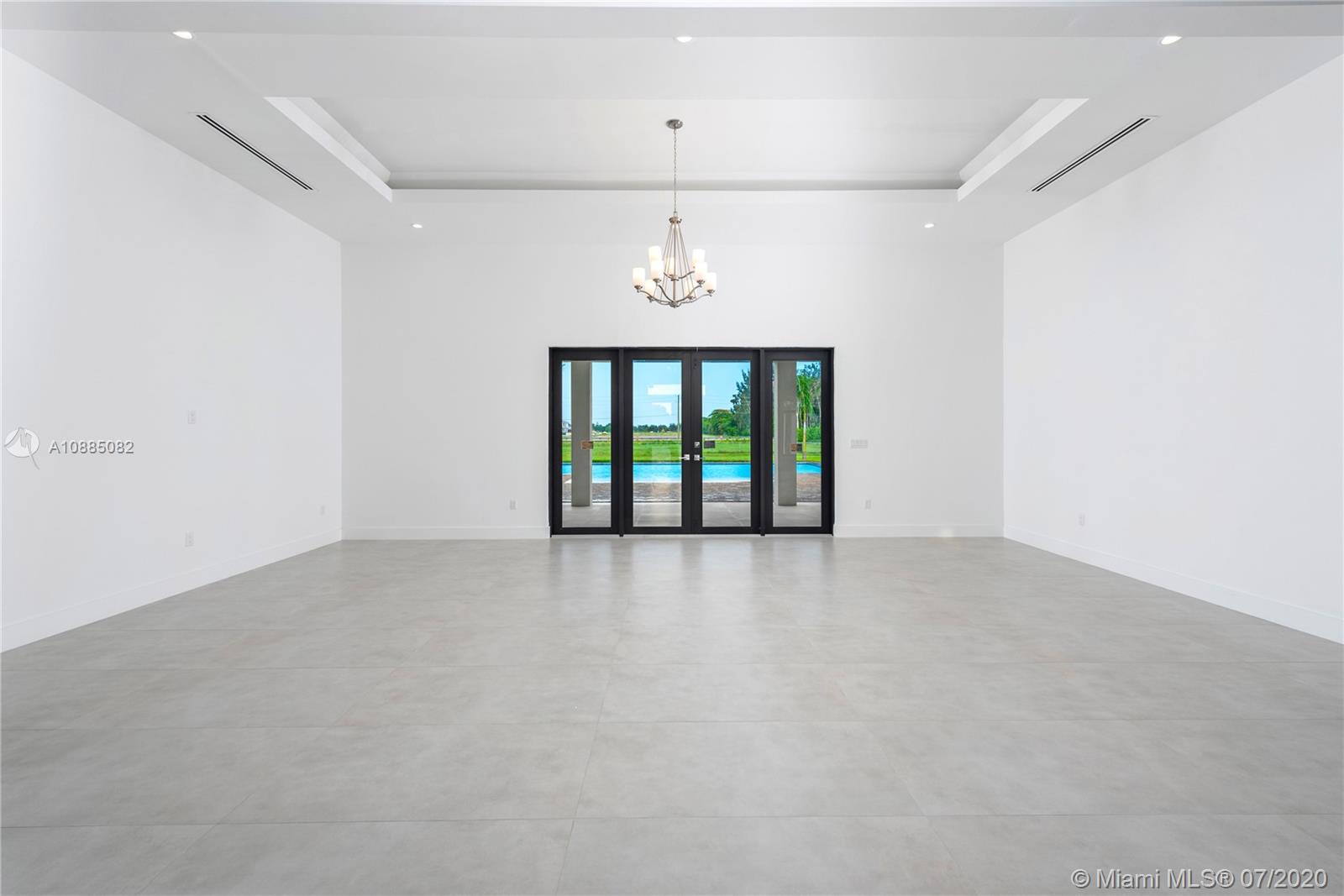 6122 Southwest 173rd Way Southwest Ranches, FL 33331 - Photo 6 of 29 an empty room with windows and ceiling fan