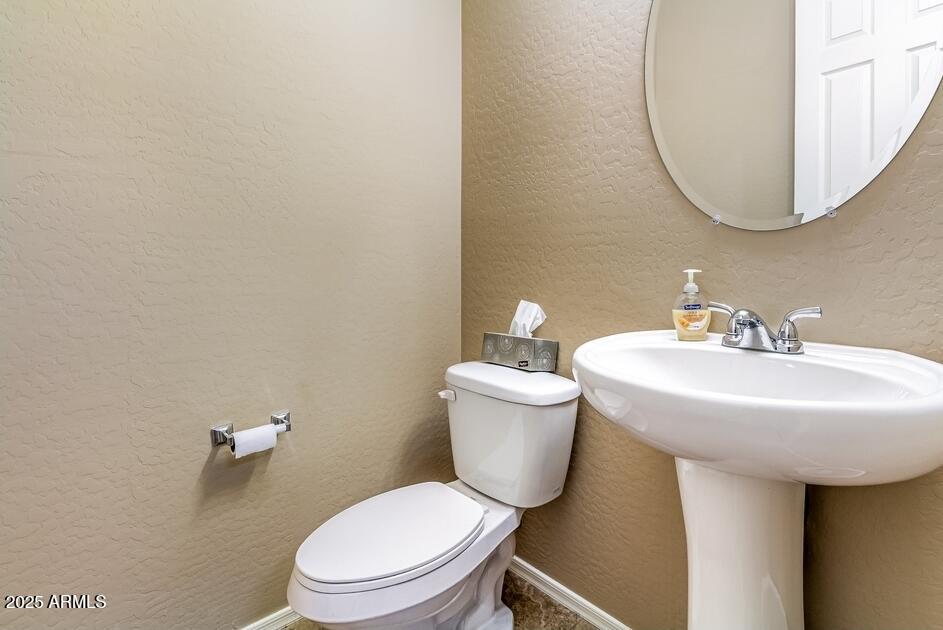 16093 West Almeria Road Goodyear, AZ 85395 - Photo 27 of 38 half bath