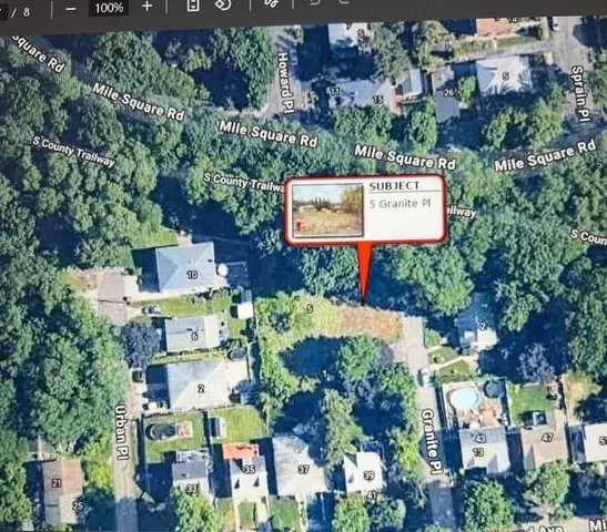 an aerial view of residential houses with outdoor space and street view