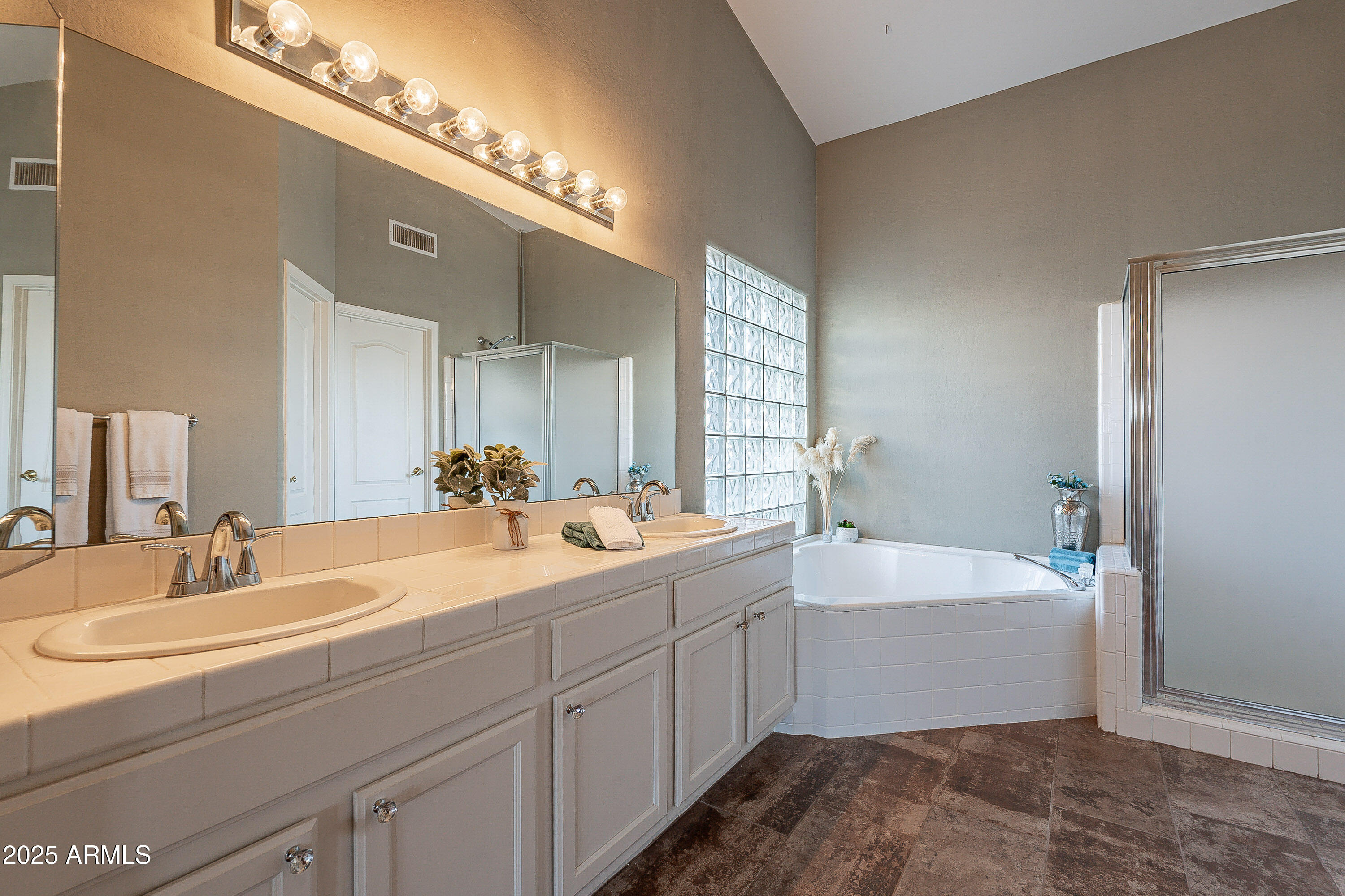 5960 East Grapevine Road Cave Creek, AZ 85331 - Photo 12 of 54 a bathroom with a tub sink and mirror