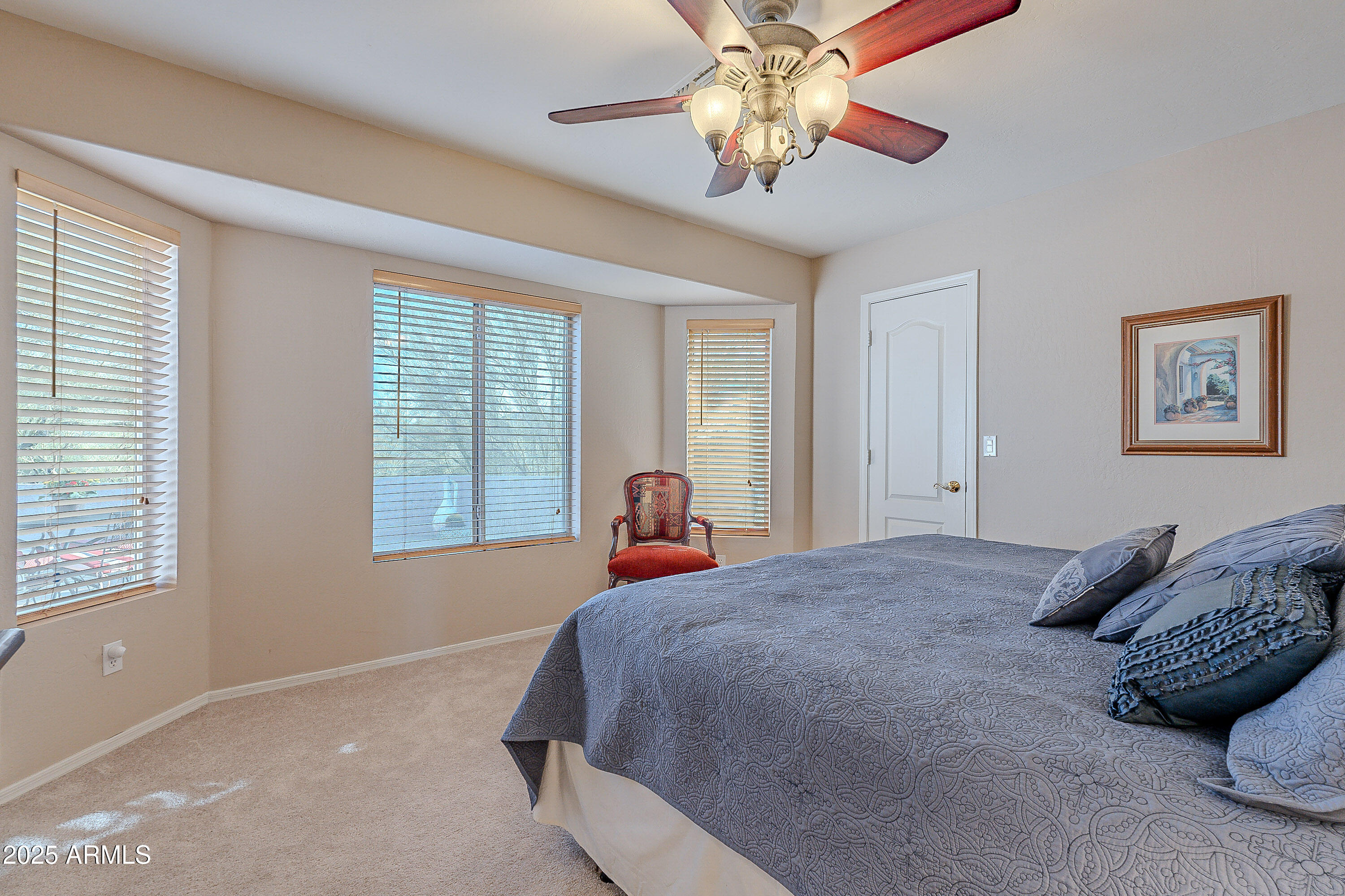 5960 East Grapevine Road Cave Creek, AZ 85331 - Photo 13 of 54 a bed sitting in a bedroom next to a window