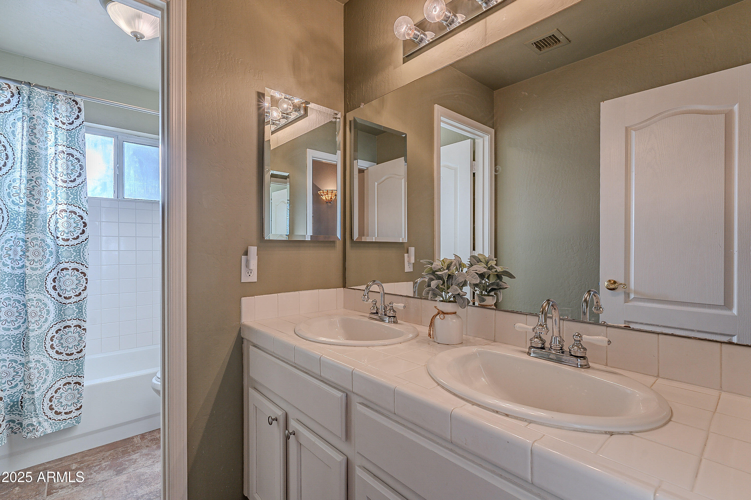 5960 East Grapevine Road Cave Creek, AZ 85331 - Photo 14 of 54 a bathroom with a sink and a mirror