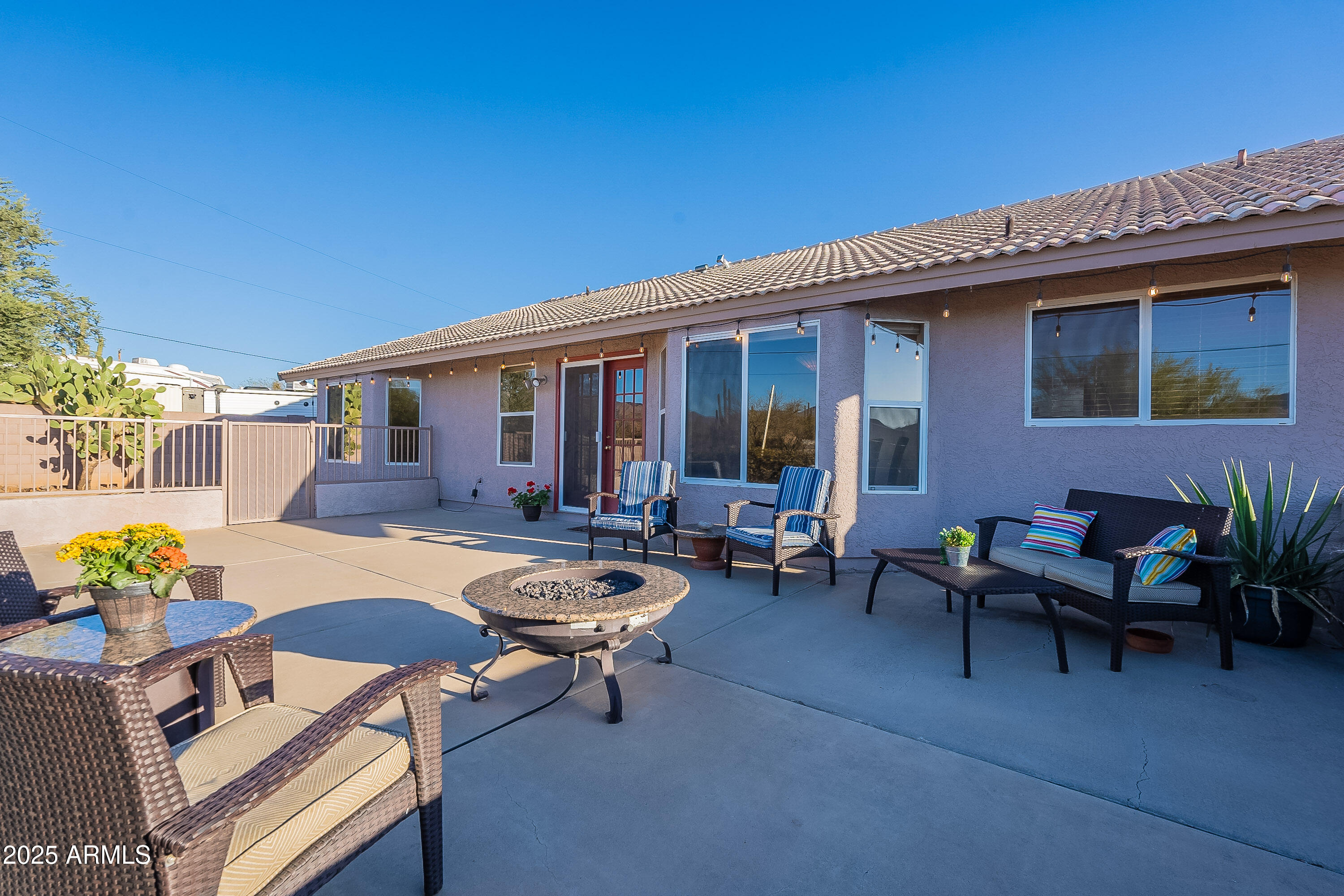 5960 East Grapevine Road Cave Creek, AZ 85331 - Photo 19 of 54 a view of a backyard with swimming pool and furniture
