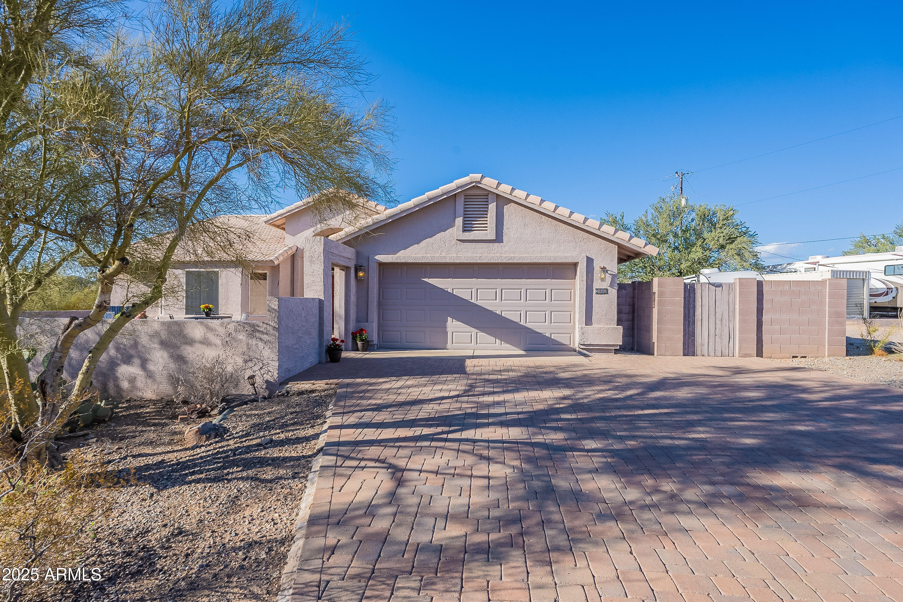 5960 East Grapevine Road Cave Creek, AZ 85331 - Photo 2 of 54 a front view of a house with a yard