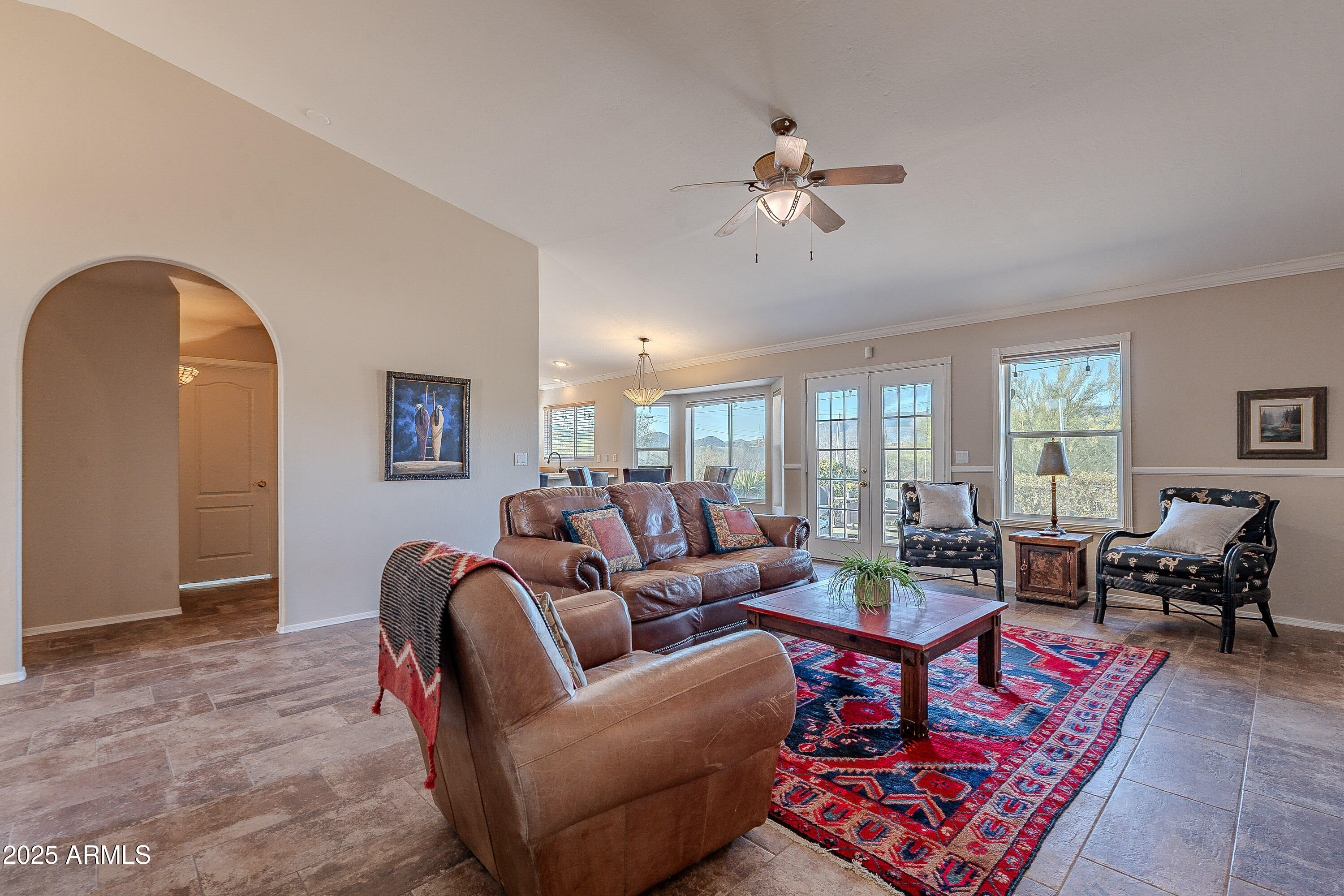5960 East Grapevine Road Cave Creek, AZ 85331 - Photo 21 of 54 a living room with furniture and wooden floor