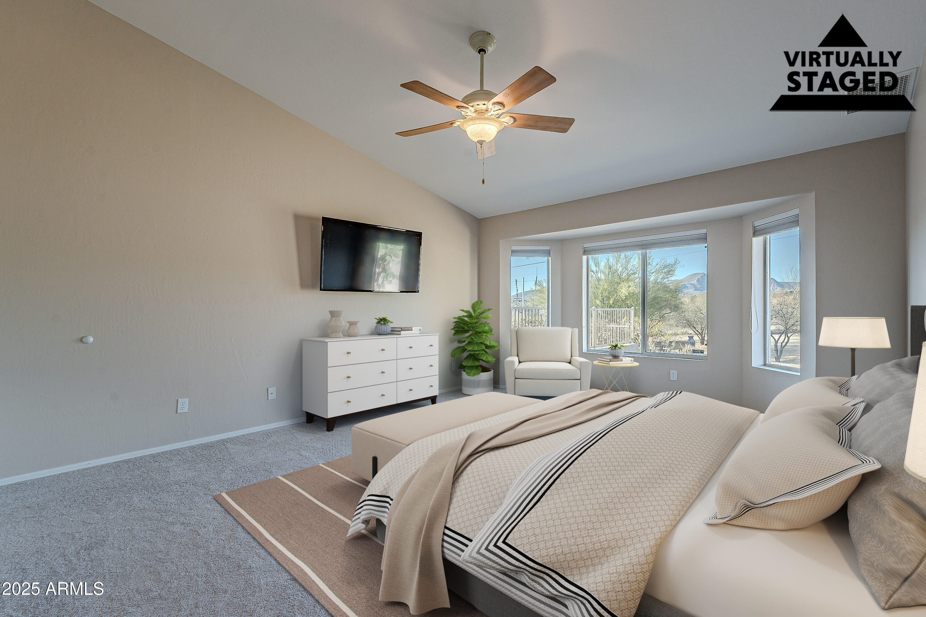 5960 East Grapevine Road Cave Creek, AZ 85331 - Photo 24 of 54 a bedroom with a bed window and a flat screen tv