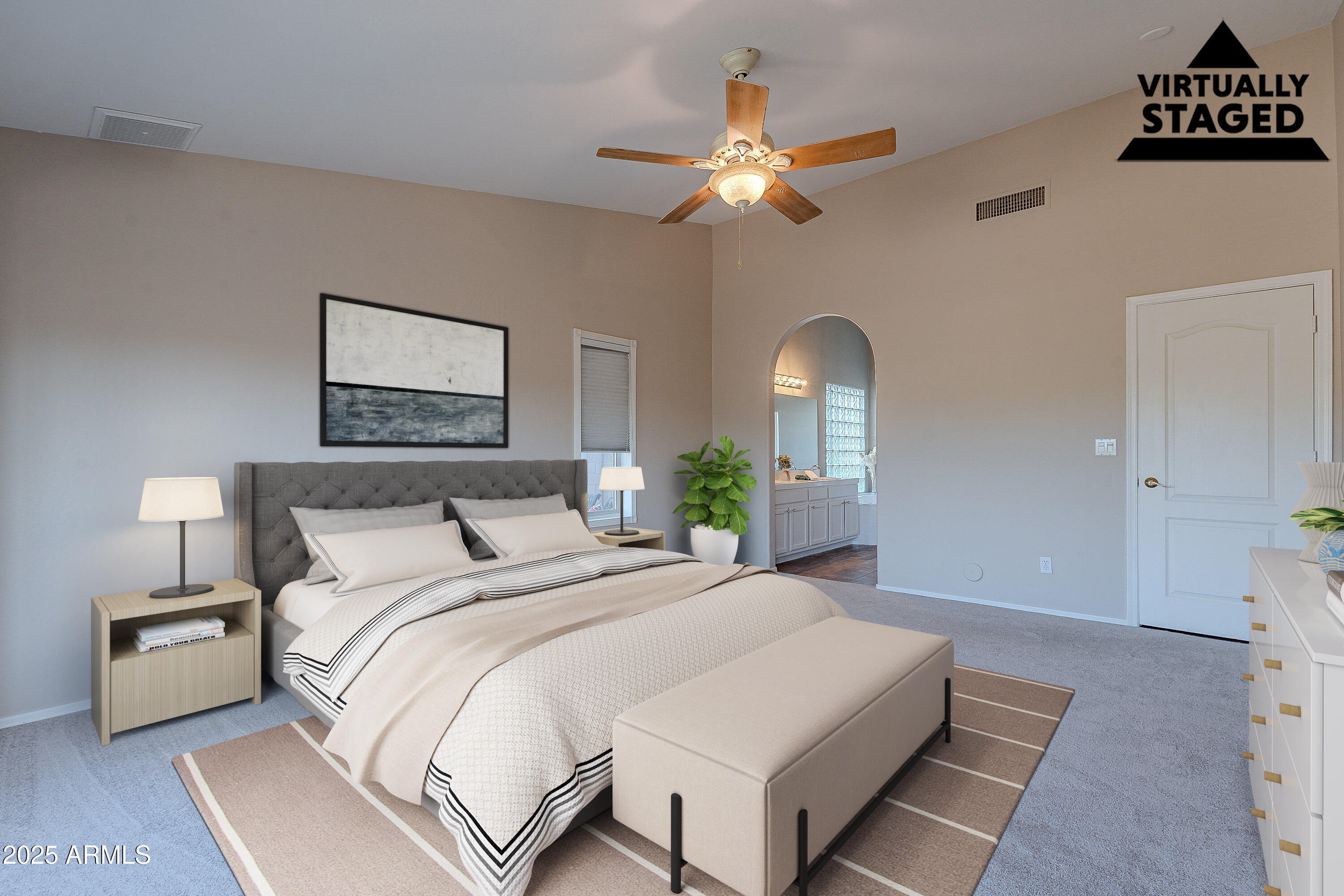5960 East Grapevine Road Cave Creek, AZ 85331 - Photo 27 of 54 a spacious bedroom with a bed and a lamp