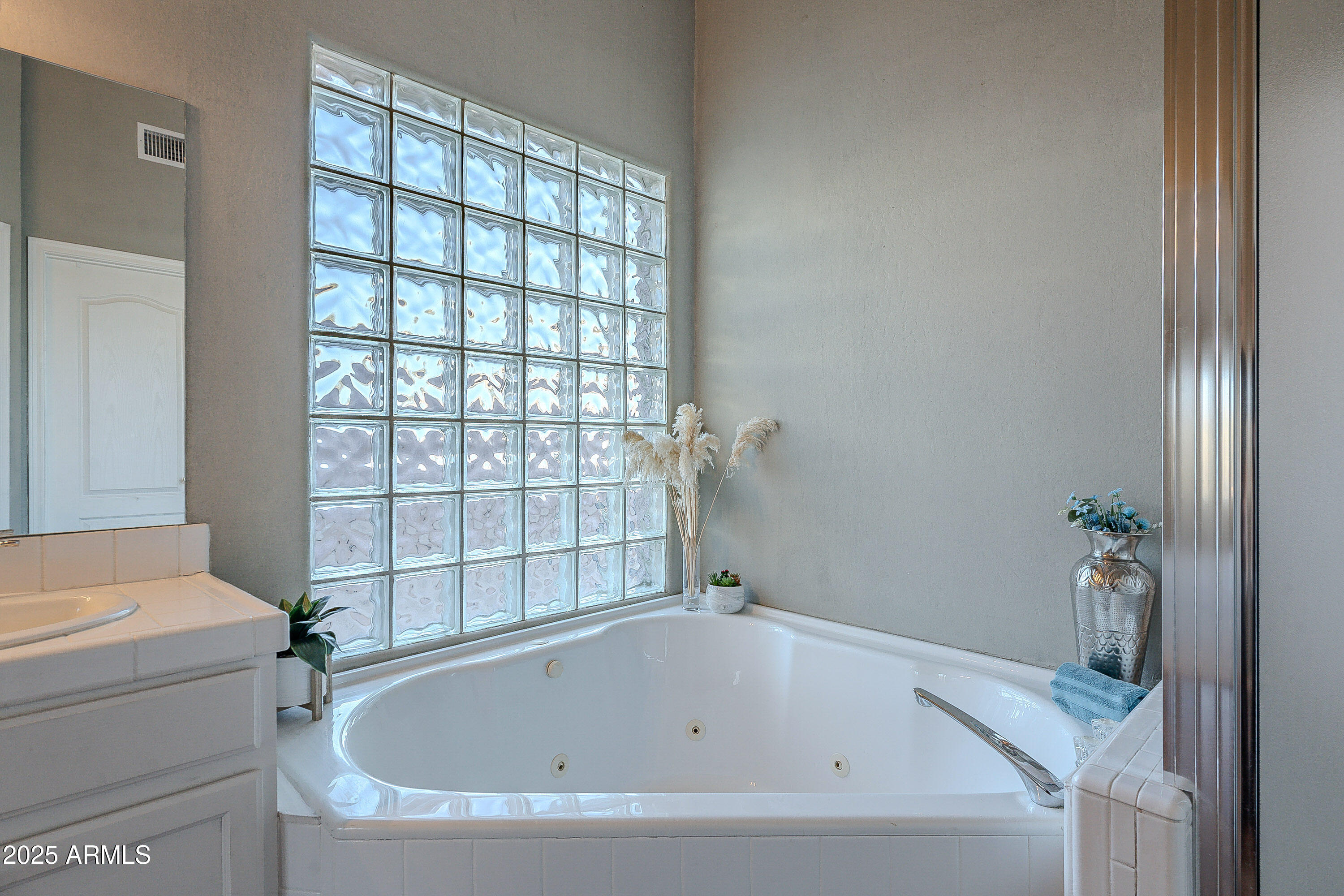 5960 East Grapevine Road Cave Creek, AZ 85331 - Photo 28 of 54 a bathroom with a tub and shower