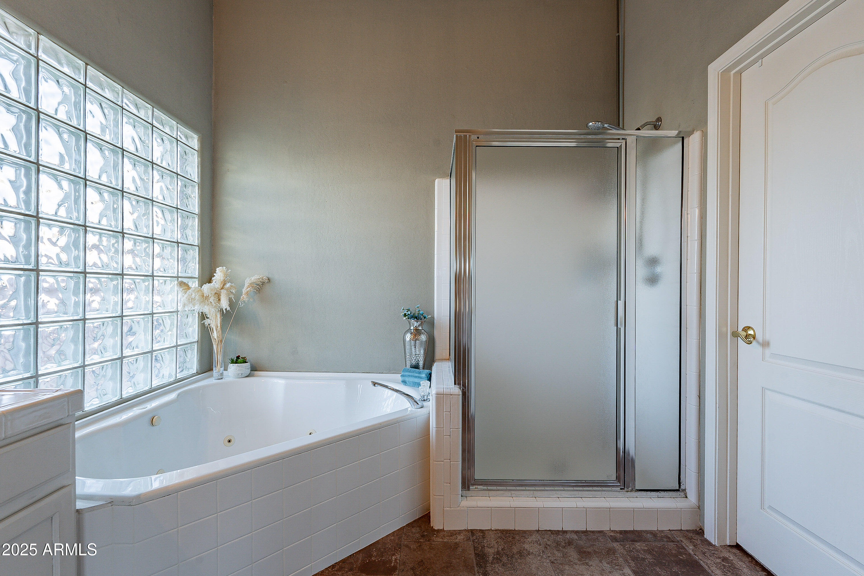 5960 East Grapevine Road Cave Creek, AZ 85331 - Photo 29 of 54 a bathroom with a bathtub and a shower