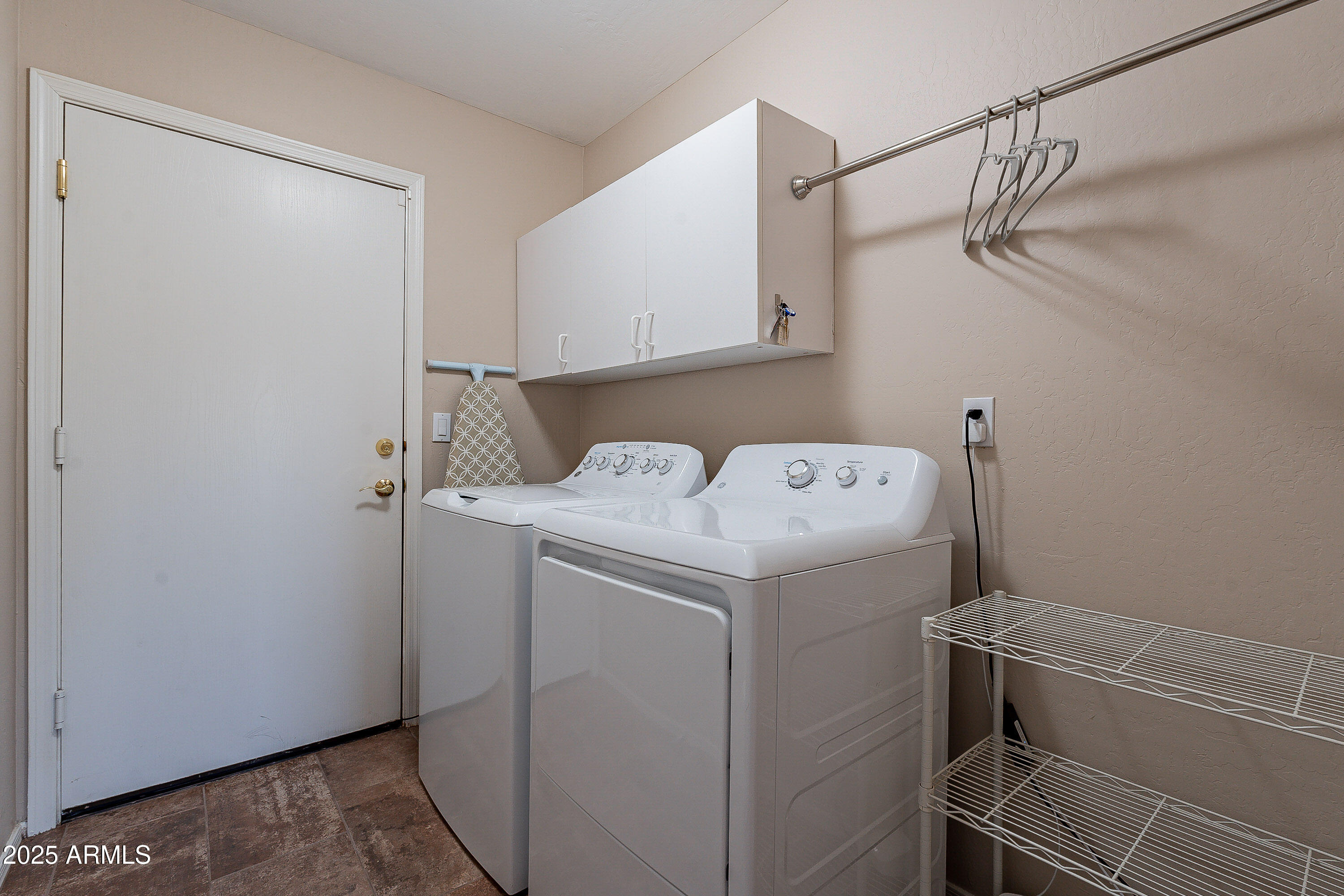 5960 East Grapevine Road Cave Creek, AZ 85331 - Photo 34 of 54 a utility room with dryer and washer