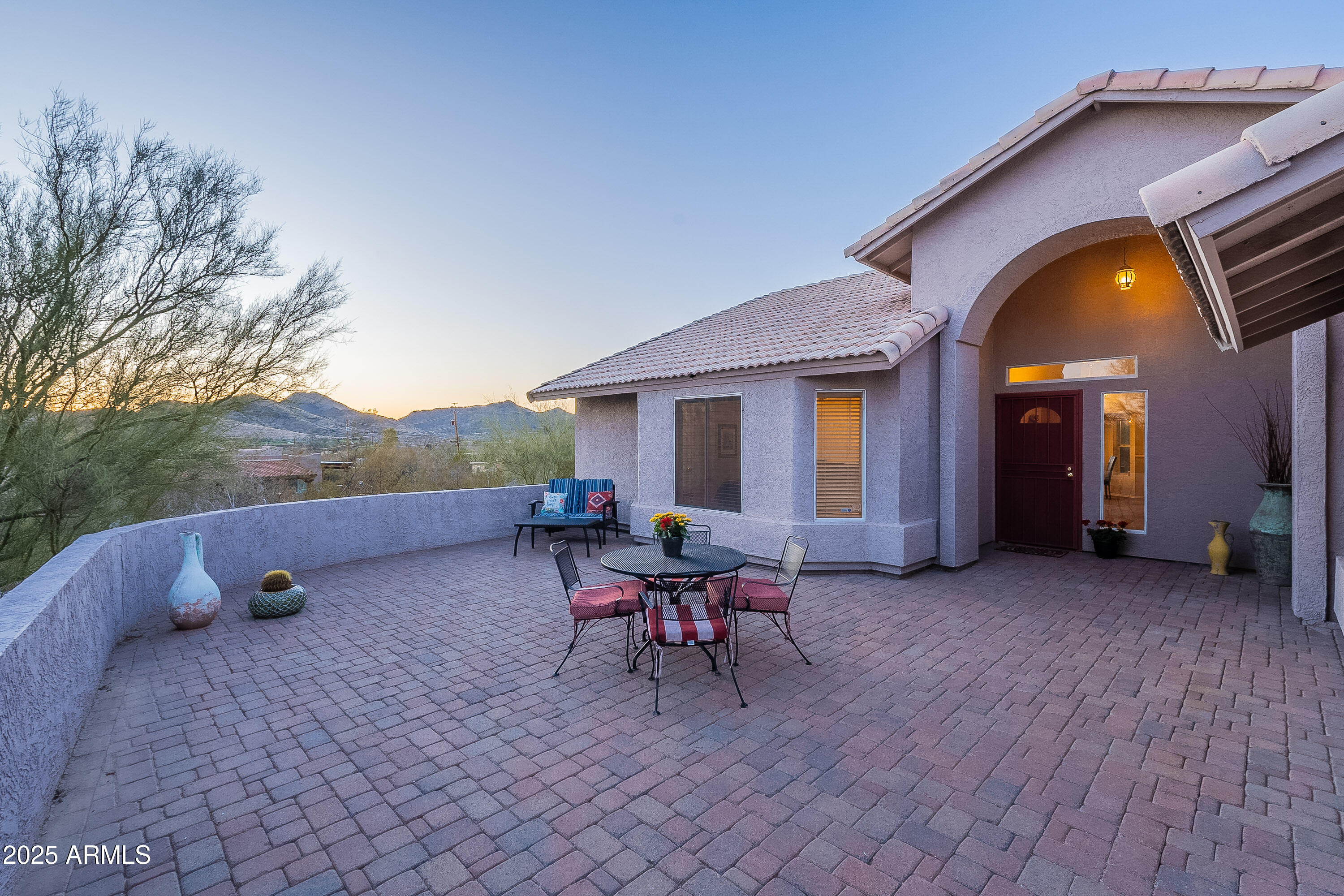5960 East Grapevine Road Cave Creek, AZ 85331 - Photo 43 of 54 a view of a house with backyard and porch
