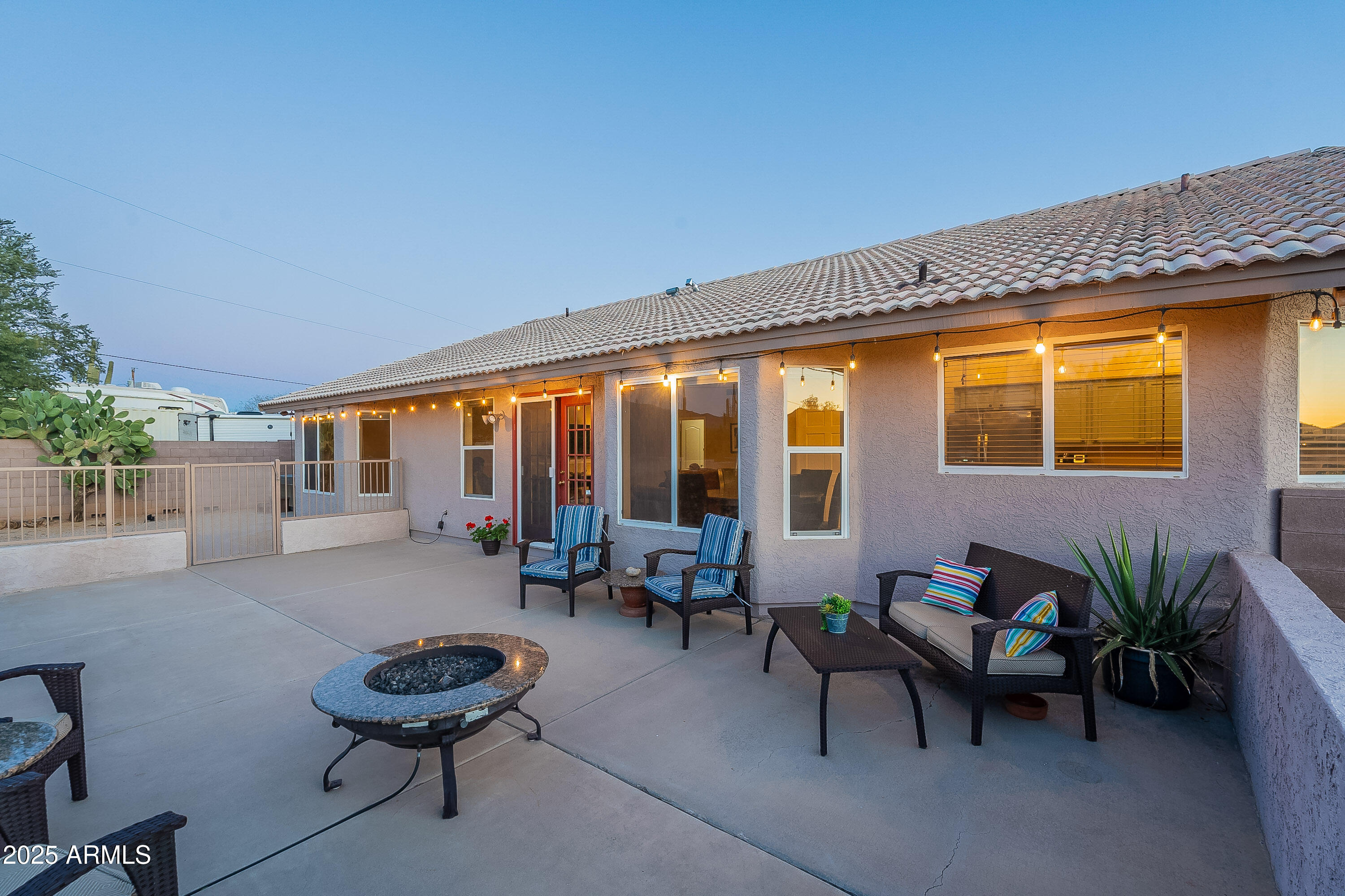 5960 East Grapevine Road Cave Creek, AZ 85331 - Photo 44 of 54 a living room with furniture and floor to ceiling windows