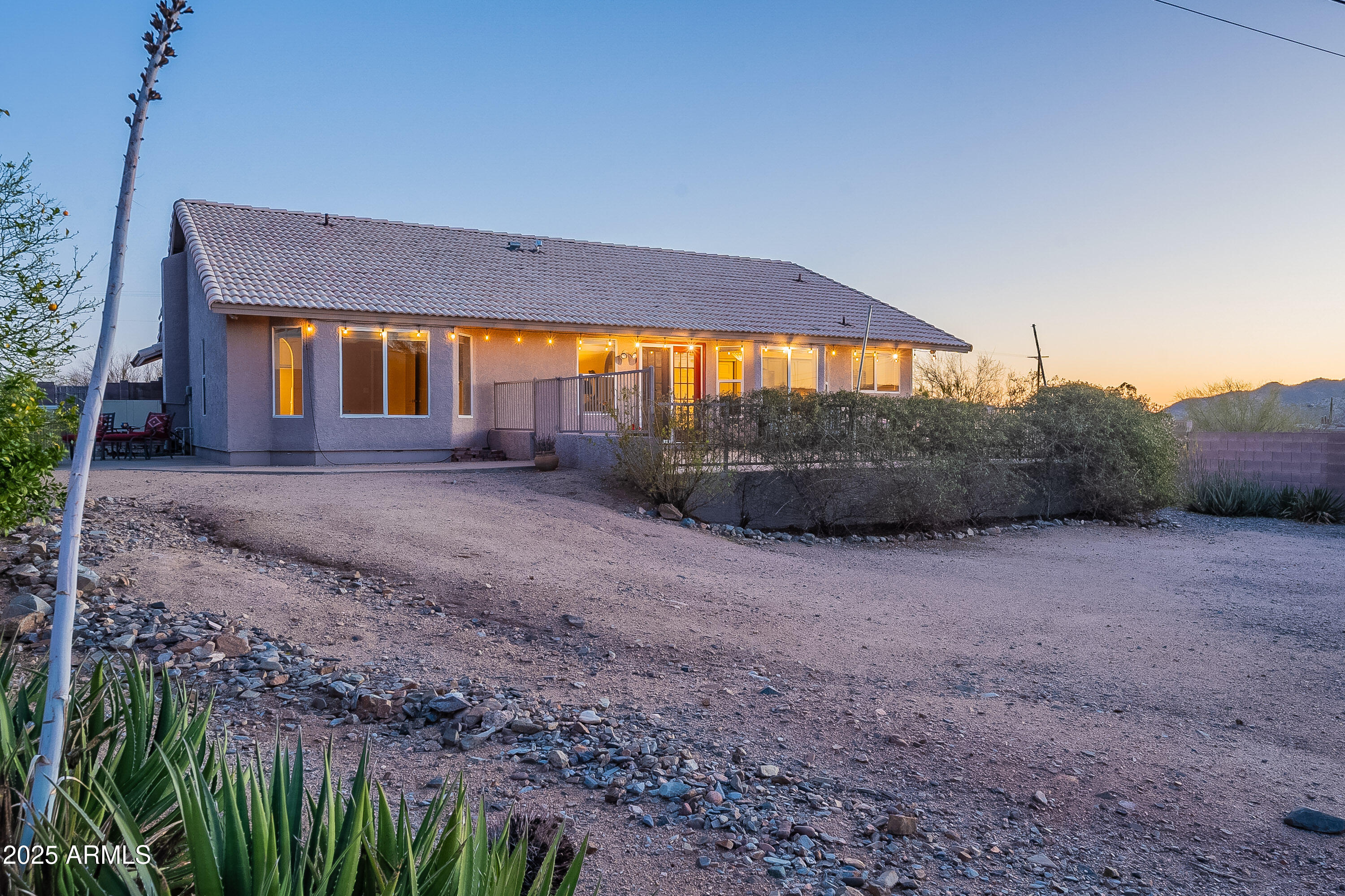 5960 East Grapevine Road Cave Creek, AZ 85331 - Photo 48 of 54 a view of a house with large trees