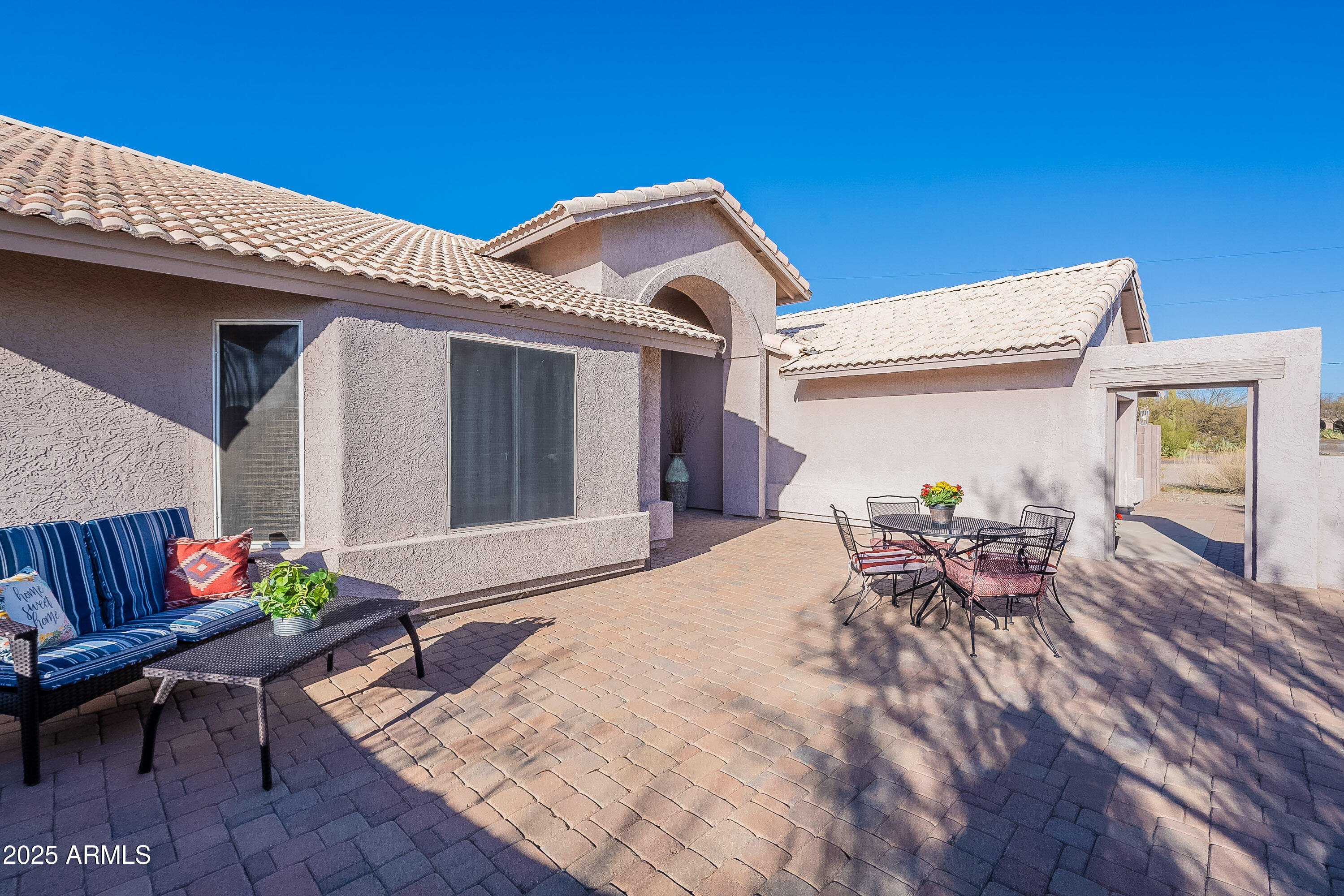 5960 East Grapevine Road Cave Creek, AZ 85331 - Photo 51 of 54 a front view of a house with outdoor seating