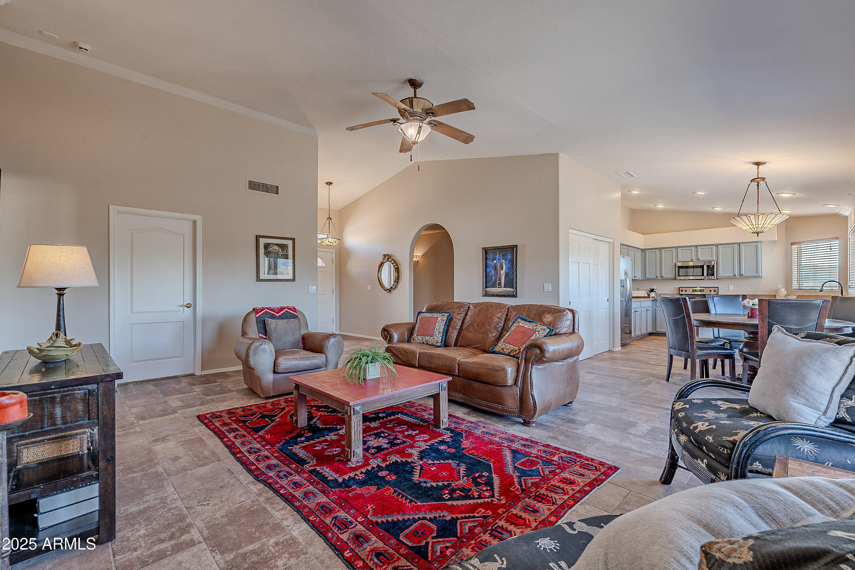 5960 East Grapevine Road Cave Creek, AZ 85331 - Photo 6 of 54 a living room with furniture and wooden floor