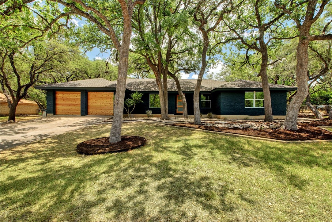 a front view of a house with yard patio and fire pit