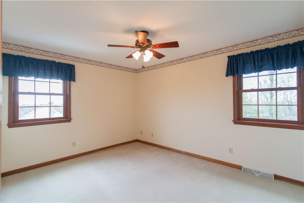 128 Moffett Run Road Aliquippa, PA 15001 - Photo 26 of 48 an empty room with windows and fan