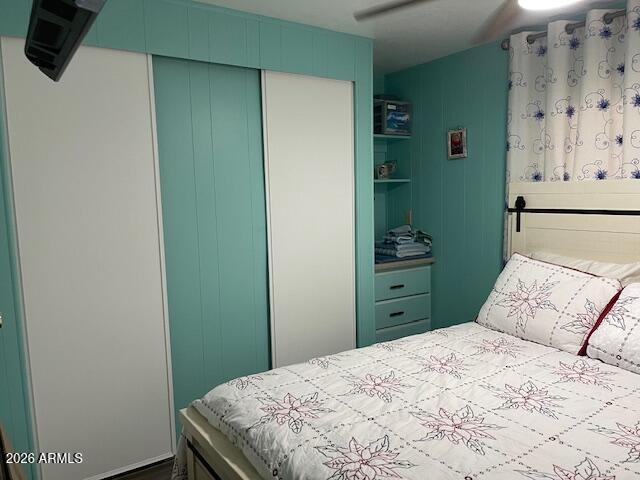 303 South Recker Road Mesa, AZ 85206 - Photo 19 of 28 a bedroom with a bed and a cabinets