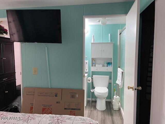 303 South Recker Road Mesa, AZ 85206 - Photo 21 of 28 a bathroom with a toilet a sink and shower