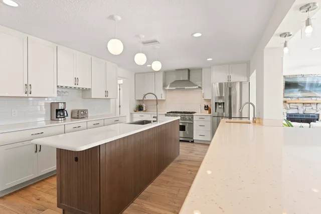 a kitchen with a stove and a sink