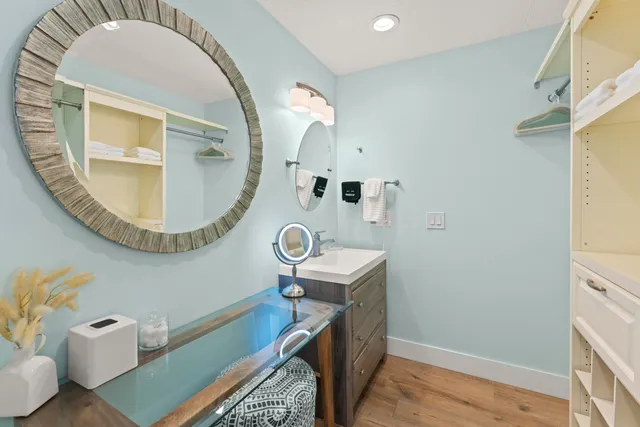 a bedroom with a bed and a lamp