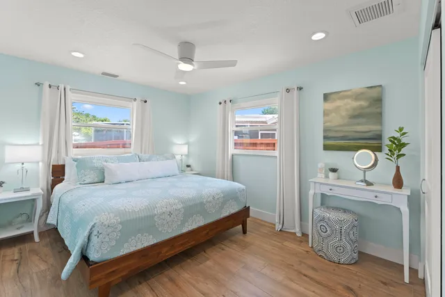 a bedroom with a bed and a couch