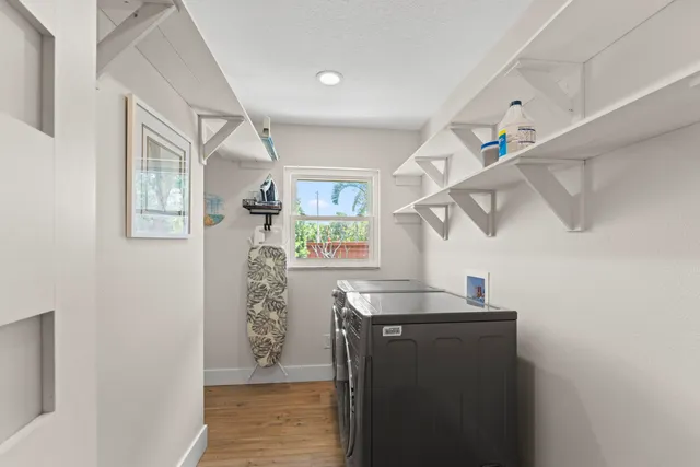 a view of a house with a swimming pool and a yard