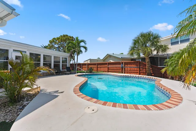 a view of a patio with swimming pool