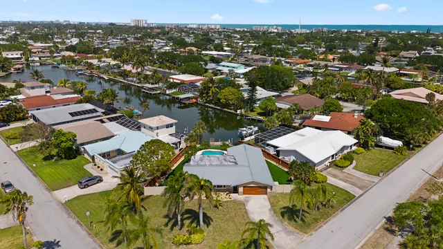 an aerial view of residential houses with outdoor space