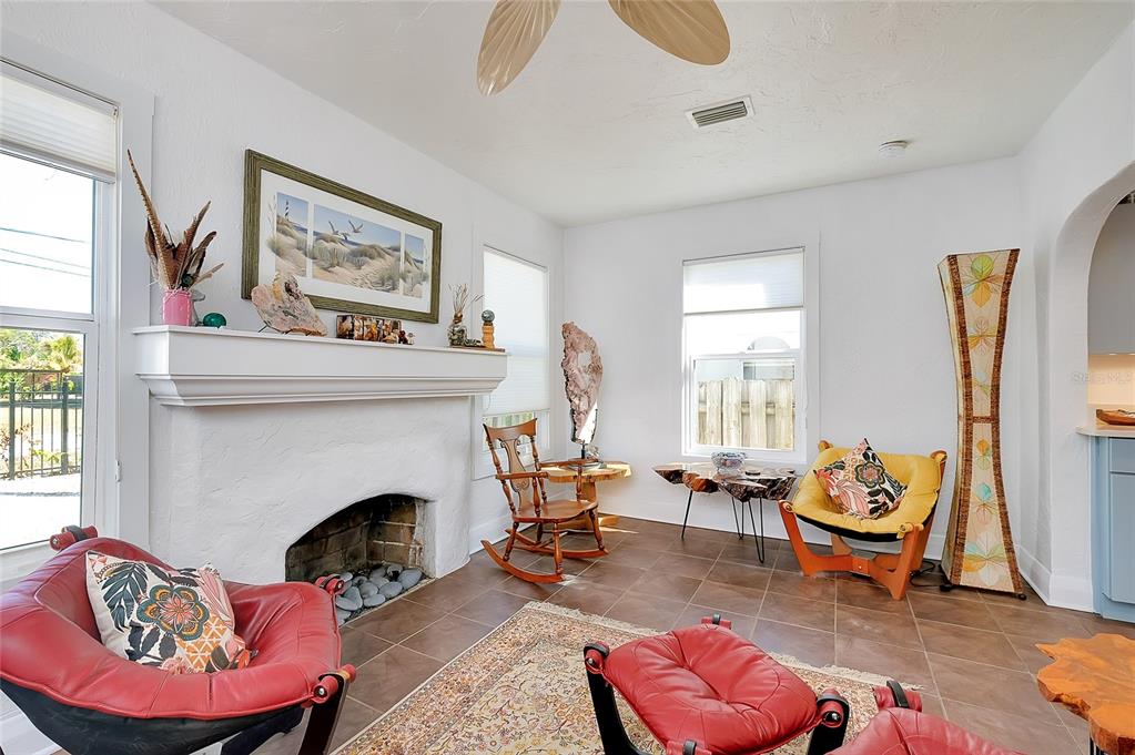 223 Palmetto Road West Nokomis, FL 34275 - Photo 11 of 100 a living room with furniture and a fireplace