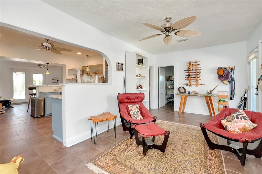 223 Palmetto Road West Nokomis, FL 34275 - Photo 14 of 100 a living room with furniture and kitchen view