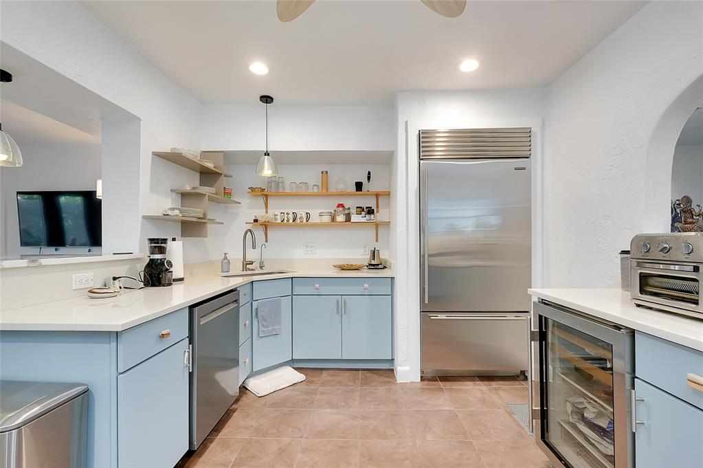 223 Palmetto Road West Nokomis, FL 34275 - Photo 16 of 100 a kitchen with a sink stainless steel appliances and cabinets