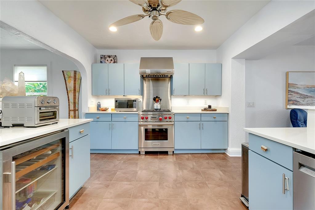 223 Palmetto Road West Nokomis, FL 34275 - Photo 17 of 100 a kitchen with a stove and a sink