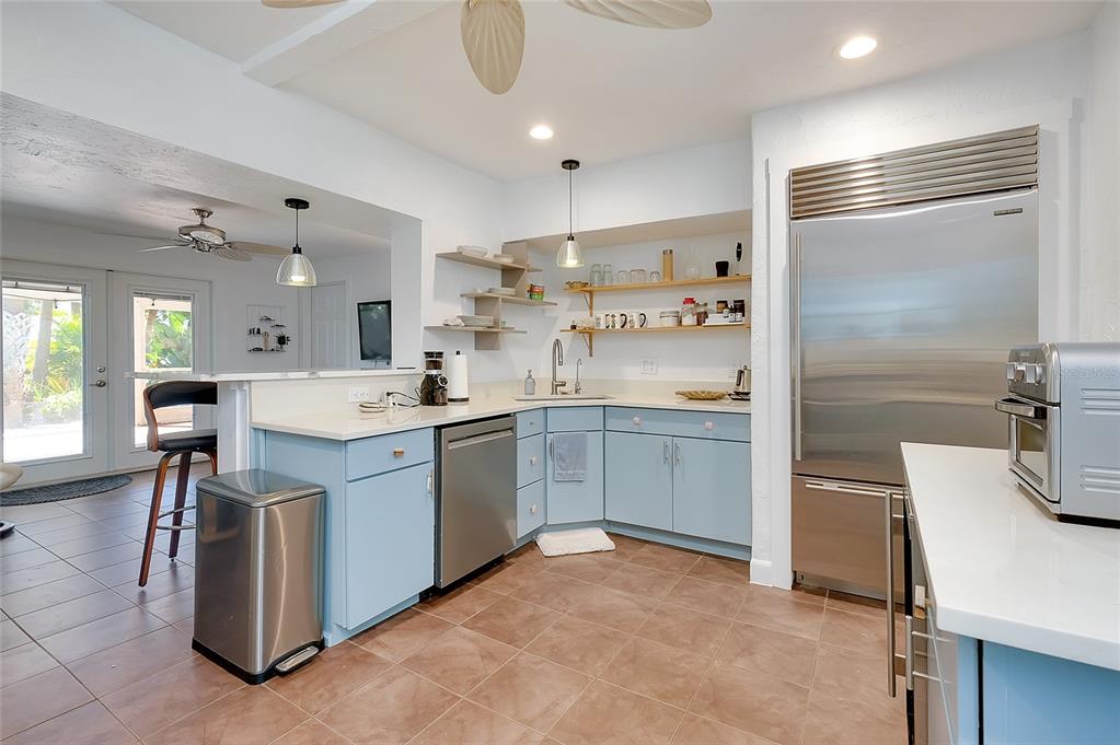 223 Palmetto Road West Nokomis, FL 34275 - Photo 18 of 100 a kitchen with a sink appliances and cabinets