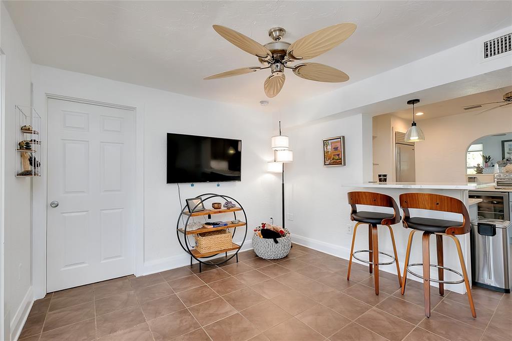223 Palmetto Road West Nokomis, FL 34275 - Photo 28 of 100 a view of a livingroom with furniture and flat screen tv