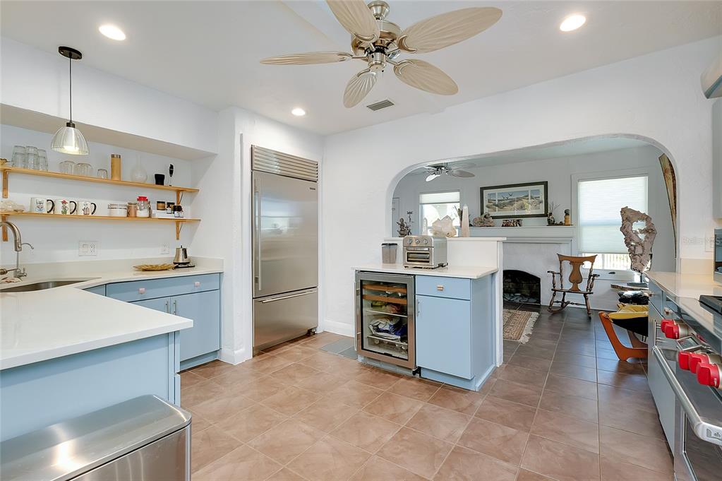 223 Palmetto Road West Nokomis, FL 34275 - Photo 29 of 100 a kitchen with stainless steel appliances a stove a sink cabinets and a refrigerator